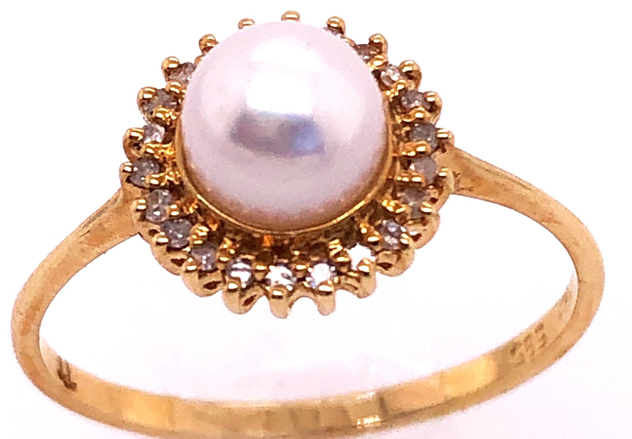 14 Karat Yellow Gold Fashion Pearl Ring with Diamonds Size 7.
5 mm diameter pearl.
1.8 grams total weight.