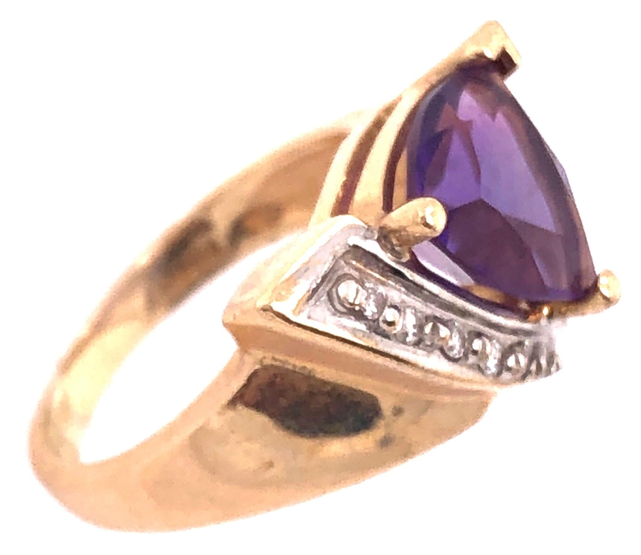 14 Karat Yellow Gold Fashion Ring with Amethyst and Round Diamond 0.10 TDW.
Size 5
5 grams total weight.