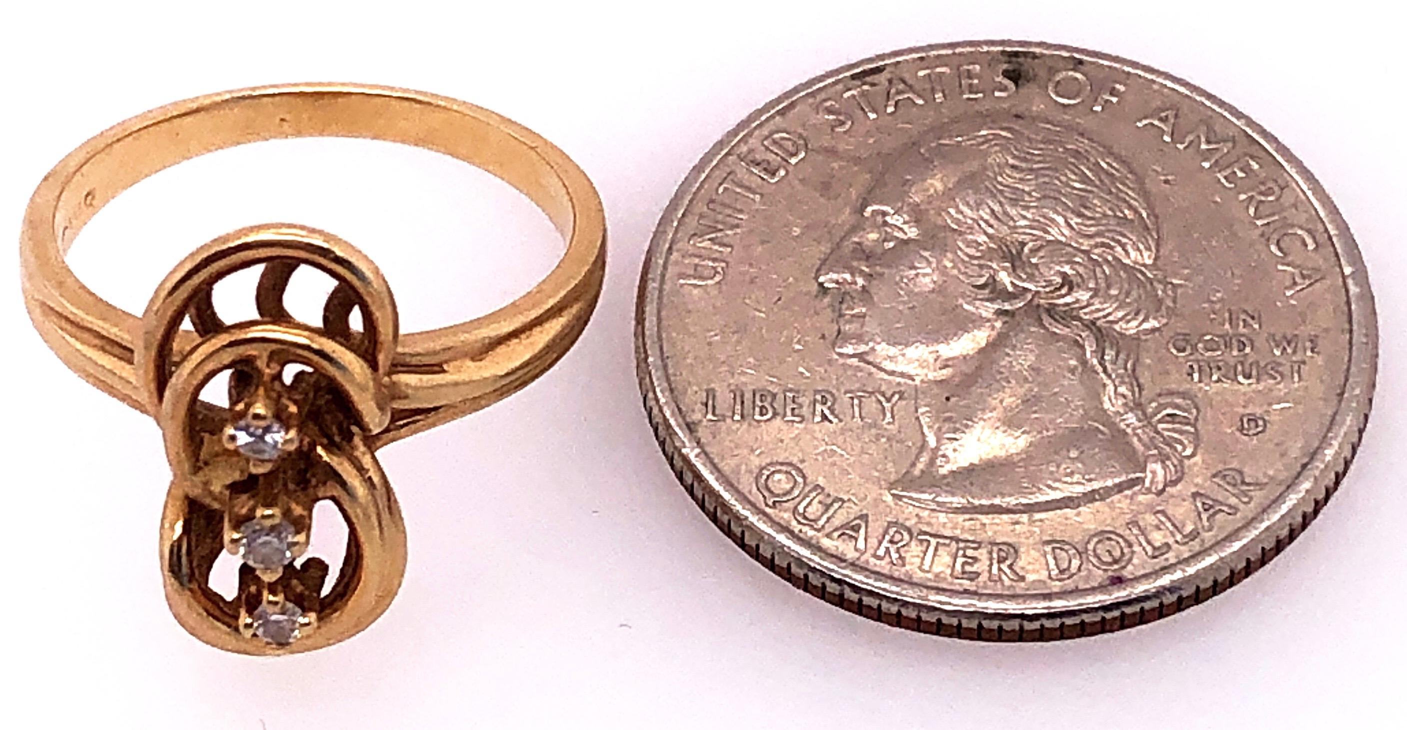 Women's or Men's 14 Karat Yellow Gold Fashion Ring with Three Round Diamonds For Sale