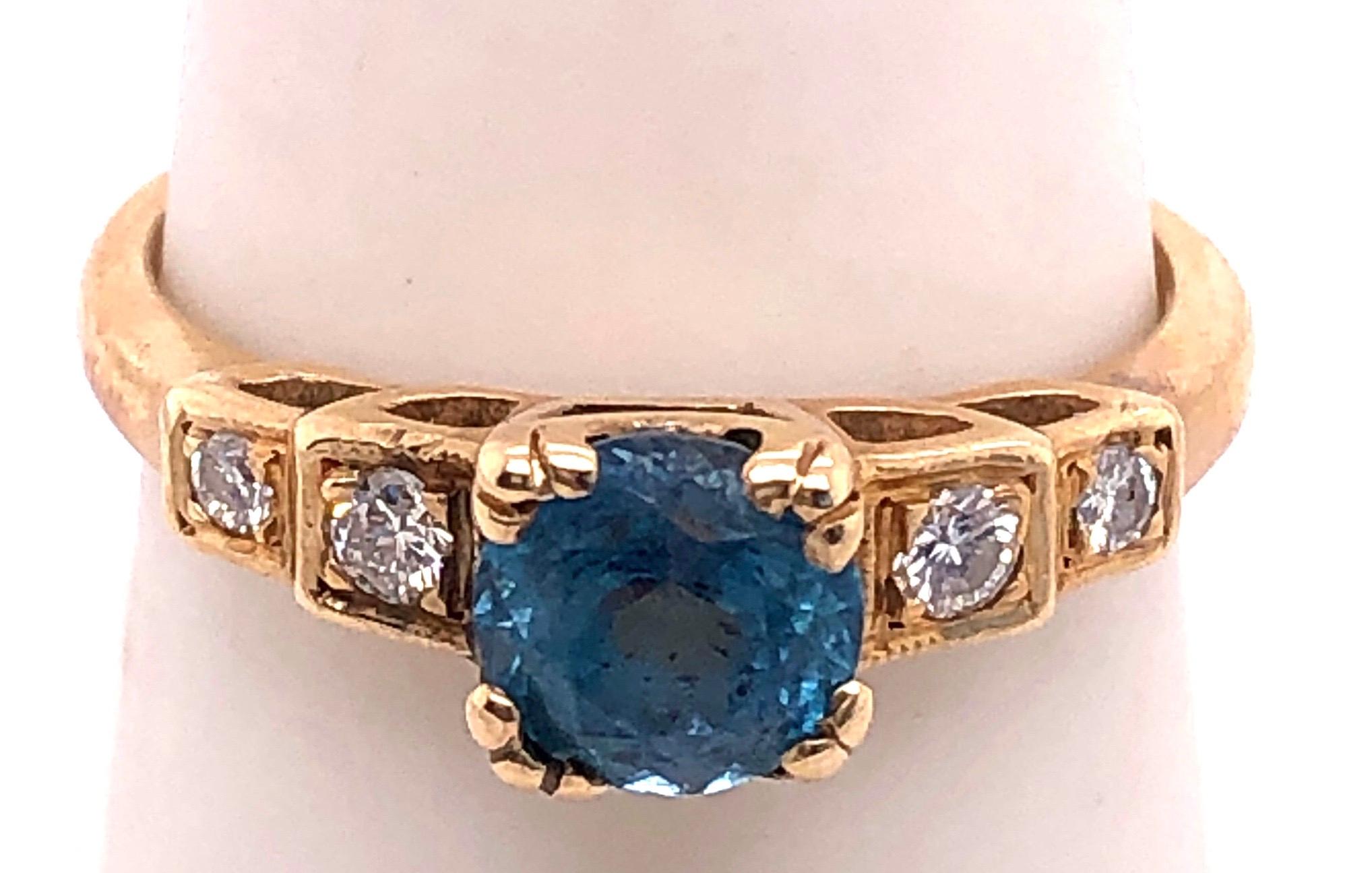14 Karat Yellow Gold Fashion Round Blue Topaz With Diamond Accents Ring
Size 7.5
3 grams total weight.