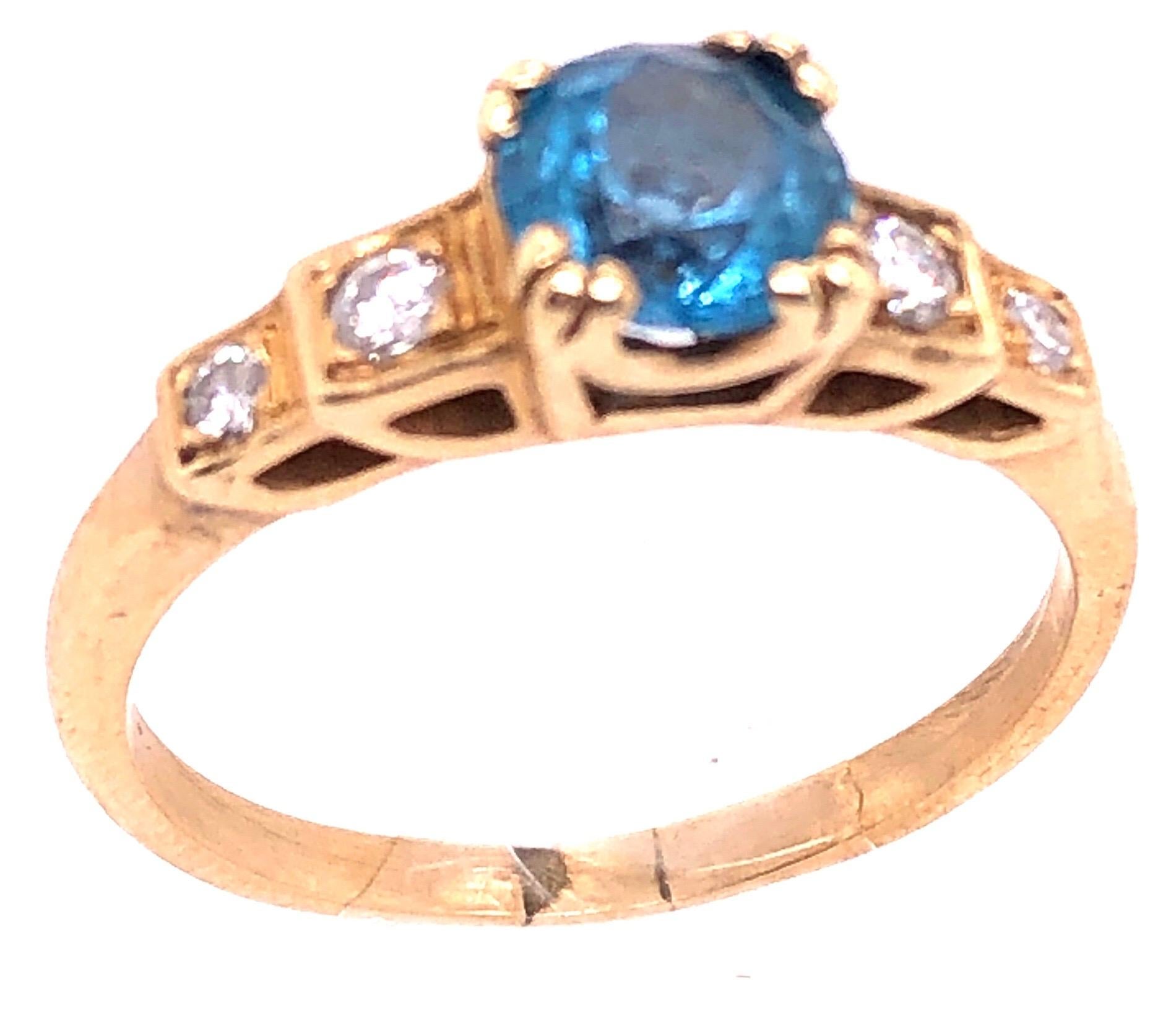 Modern 14 Karat Yellow Gold Fashion Round Blue Topaz with Diamond Accents Ring For Sale