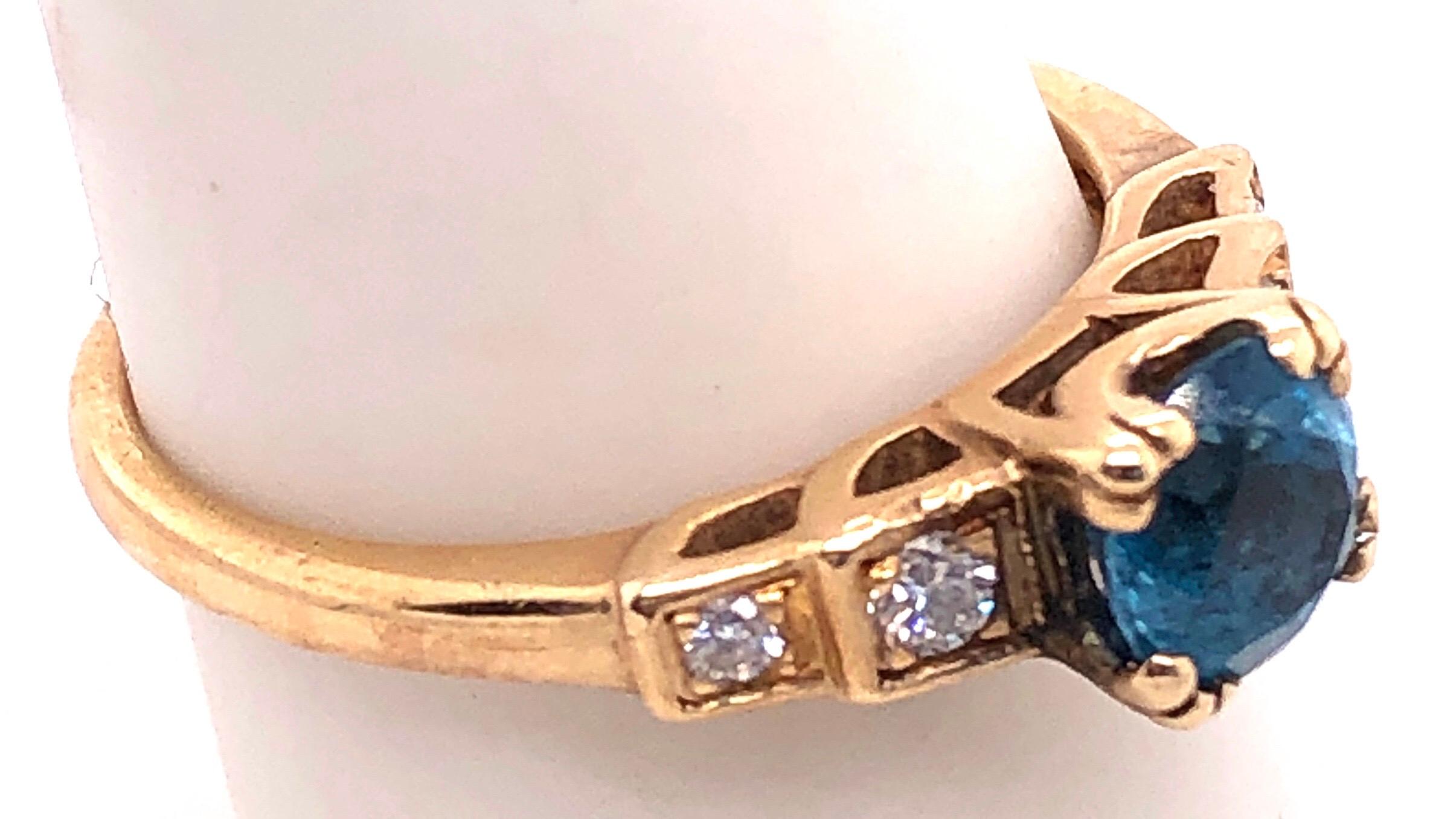 Round Cut 14 Karat Yellow Gold Fashion Round Blue Topaz with Diamond Accents Ring For Sale