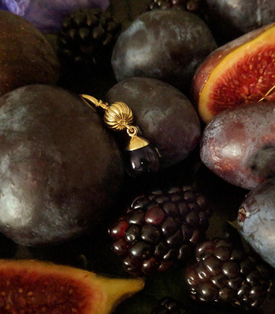 This Fig necklace pendant with the cabochon smoky quartz is made of 14 karat yellow gold. The gem drop in cognac colour is open for the light This collection was featured in Vogue UA. 

The idea to create her favourite fruits as a jewellery