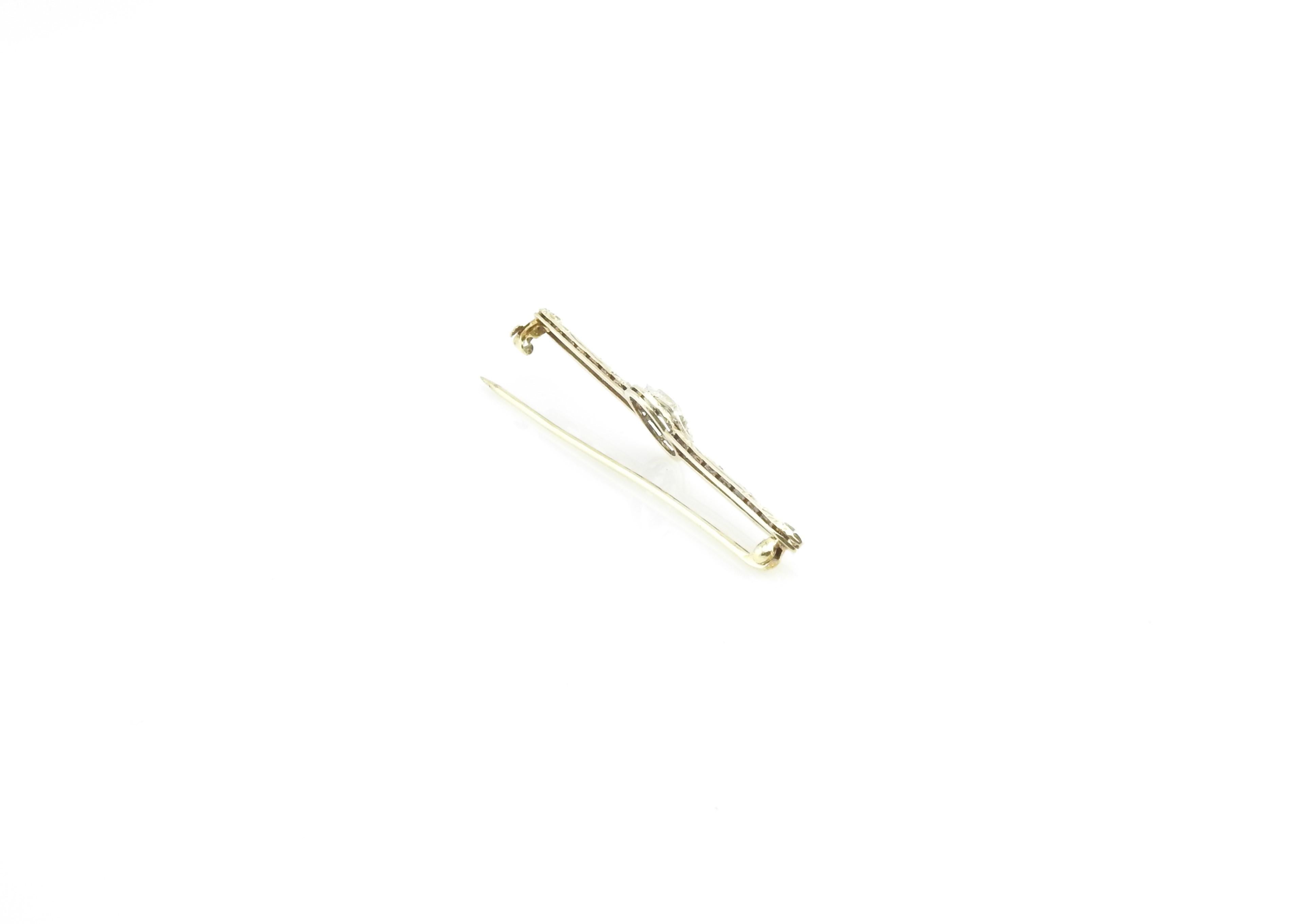 Vintage 14 Kart Yellow Gold Filigree and Diamond Bar Pin / Brooch

This lovely bar pin features one old mine cut diamond set in beautifully detailed 14K yellow gold filigree.

Approximate total diamond weight: .05 ct.

Diamond color: H

Diamond