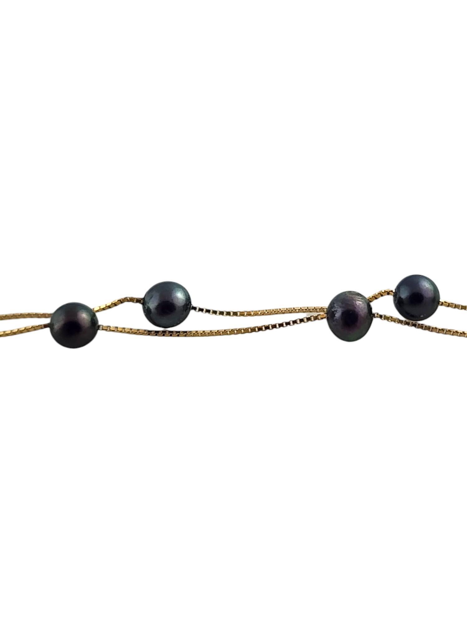 14 Karat Yellow Gold Floating Black Pearl Necklace

This stunning necklace features 11 beautiful black pearl on a 14K yellow gold chain!

Chain length: 16 3/4