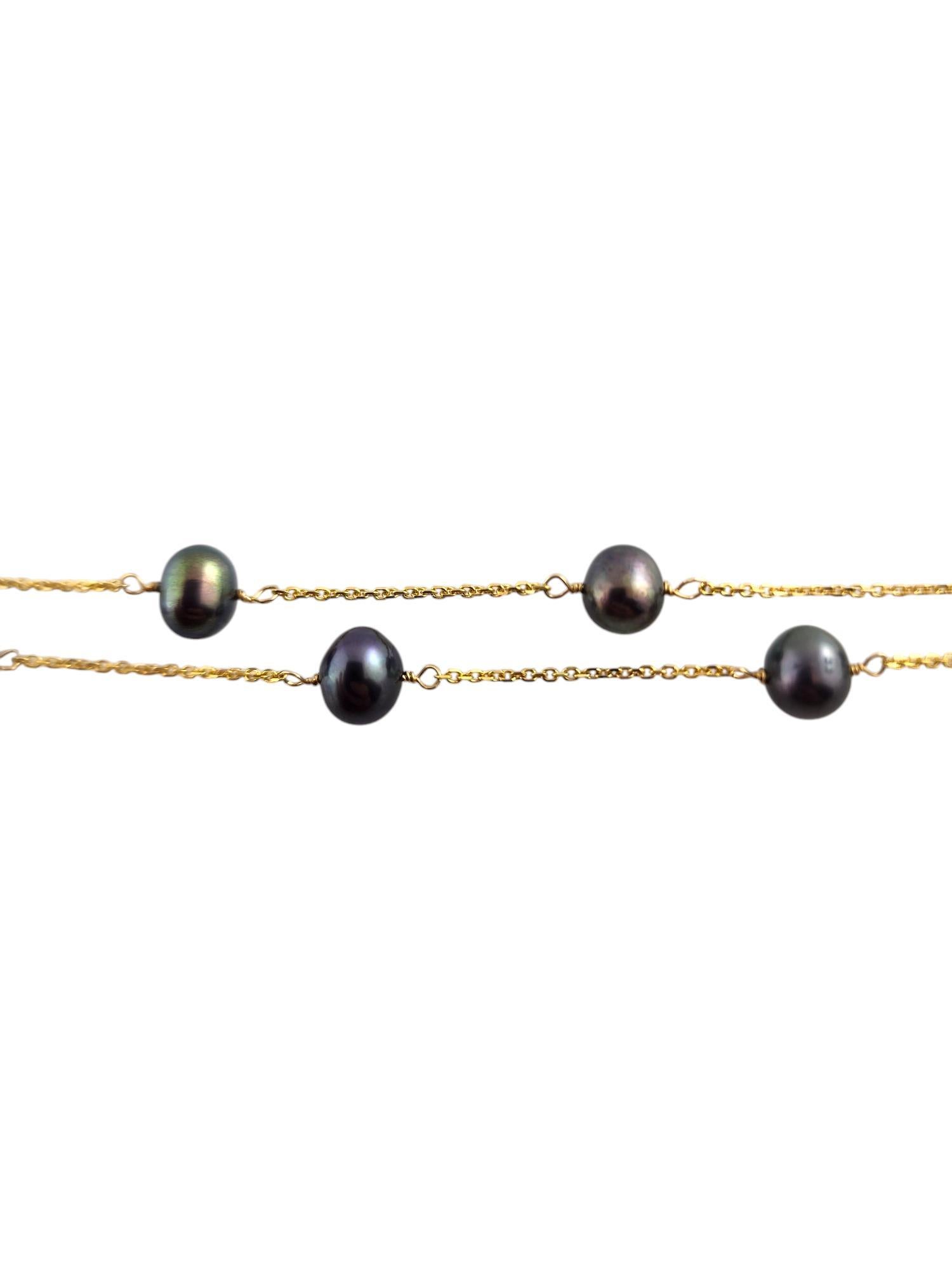 Perle Collier flottant en or jaune 14 carats et perles noires n° 19337 en vente
