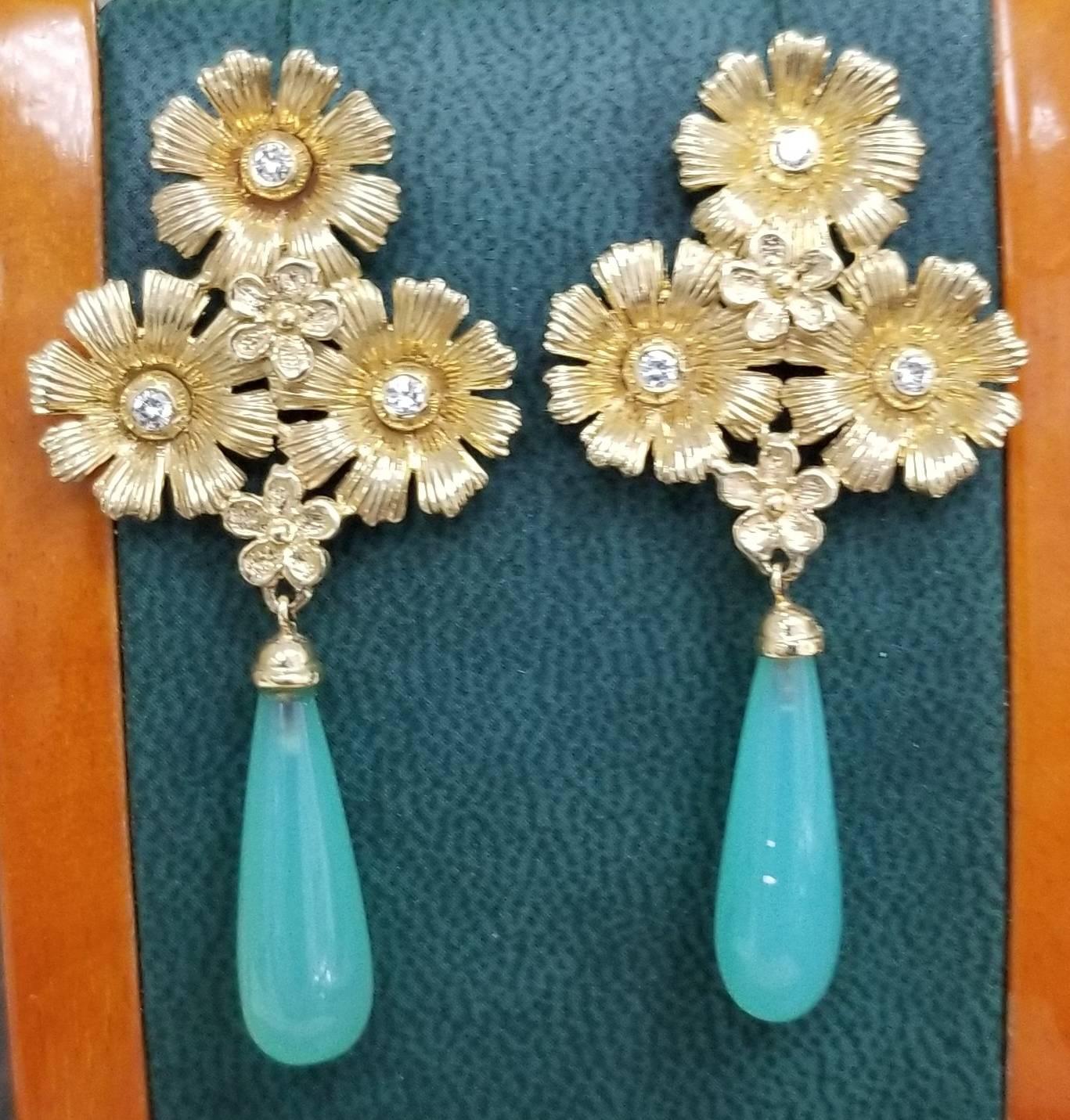 14k yellow gold flower earrings with  4 round full cut diamonds weighing .18pts. and 2 Chalcedony drops weighing 15.30cts. 
this design is ours and can be created in any other form; ring, necklace, bracelet, or earrings