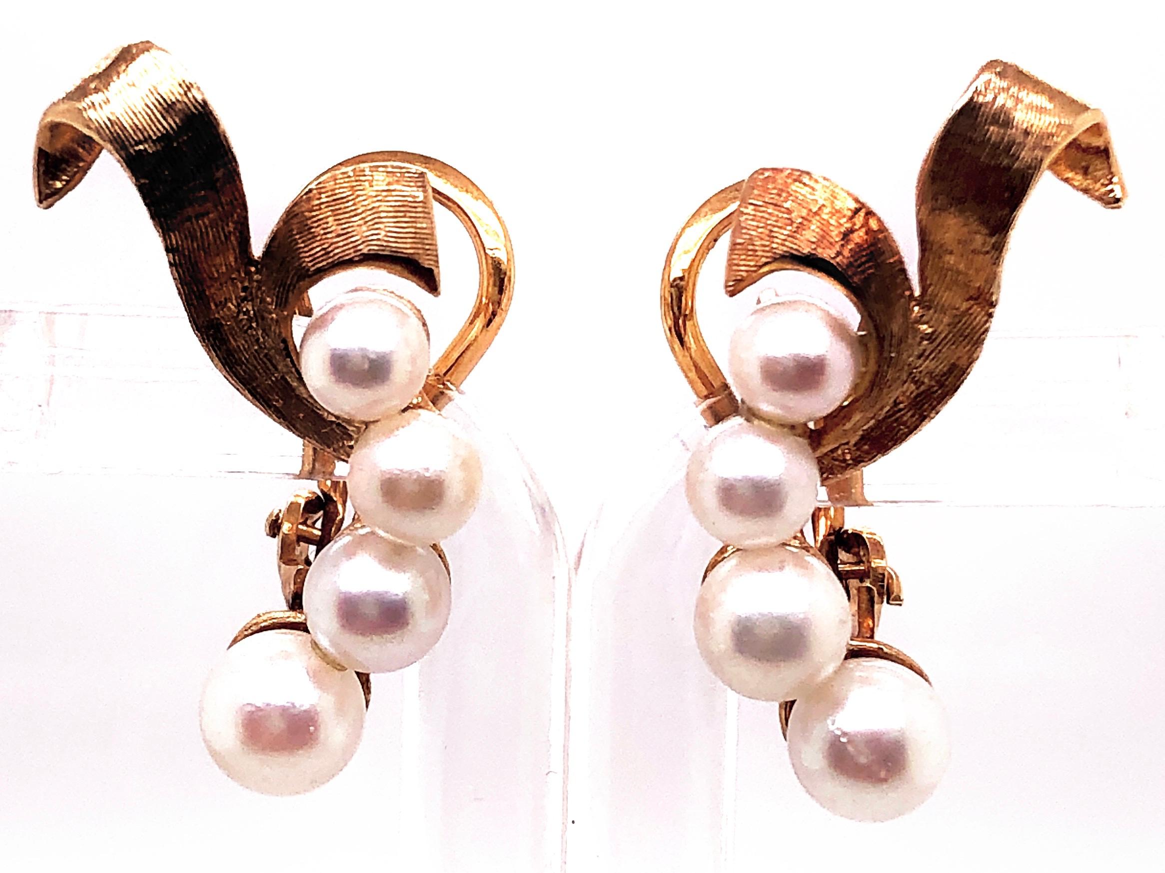 14 Karat Yellow Gold Four Pearl Drop Earrings With English Locks
6 grams total weight.