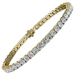 Bracciale tennis con diamanti a quattro punte in oro giallo 14 carati "7 Carati