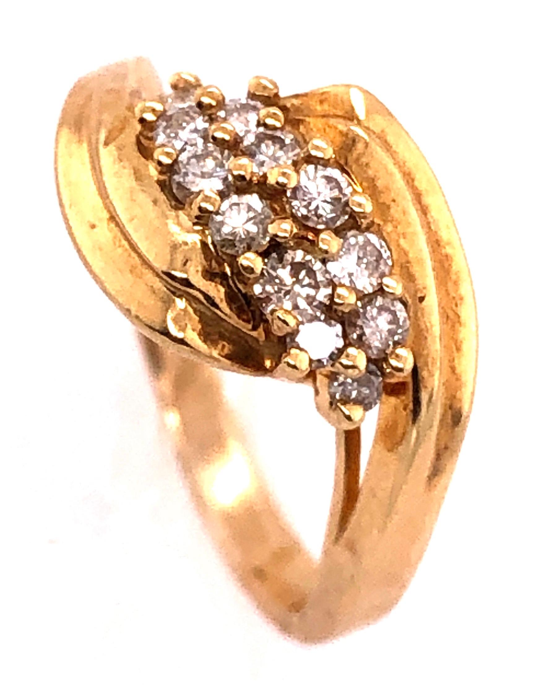 14 Karat Yellow Gold Free Form Ring with Diamonds 
0.50 TDW.
Size 5.5
4.84 grams total weight.