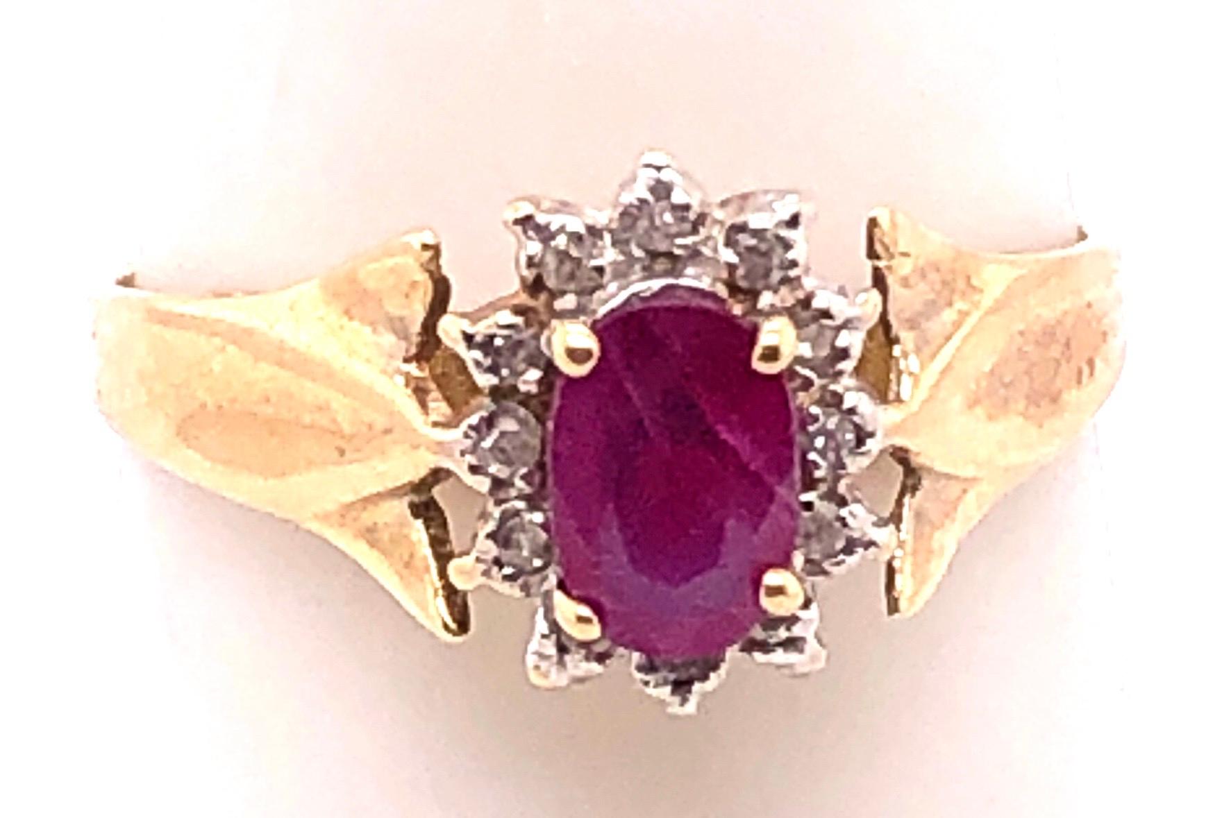 Contemporary 14 Karat Yellow Gold Free Form Ruby Center with Diamond Accents Ring For Sale