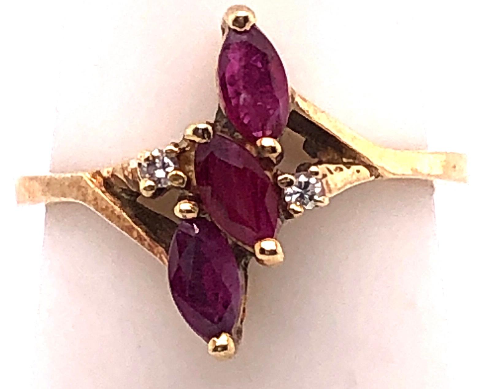 14 Karat Yellow Gold Free Form Ruby With Diamond Accent Ring Size 5.5
Size 5.5
2.80 grams total weight.