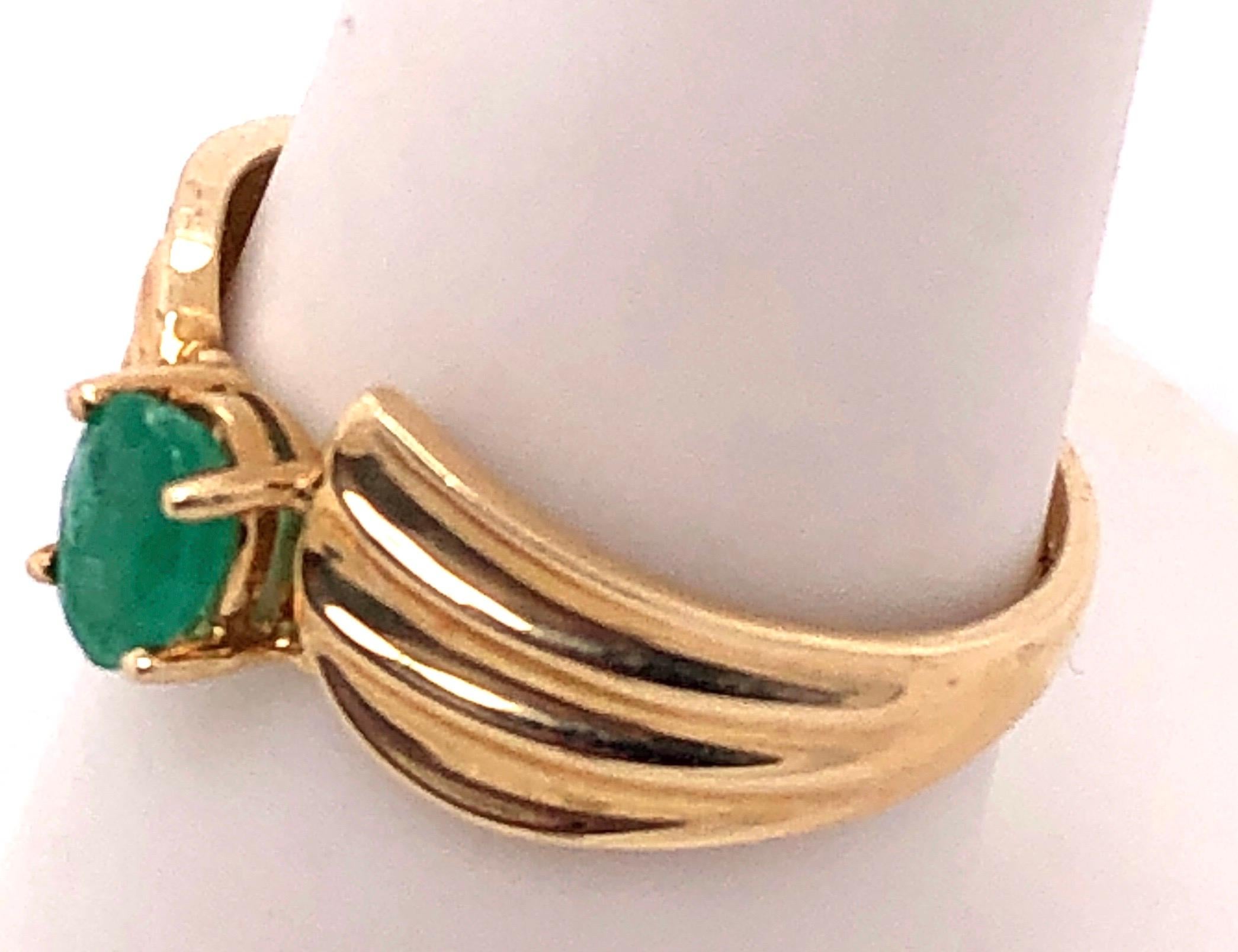 14 Karat Yellow Gold Free Form Oval Emerald Ring.
Size 9
3 grams total weight.