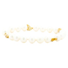 Bracelet station en or jaune 14 carats, perles d'eau douce et diamants