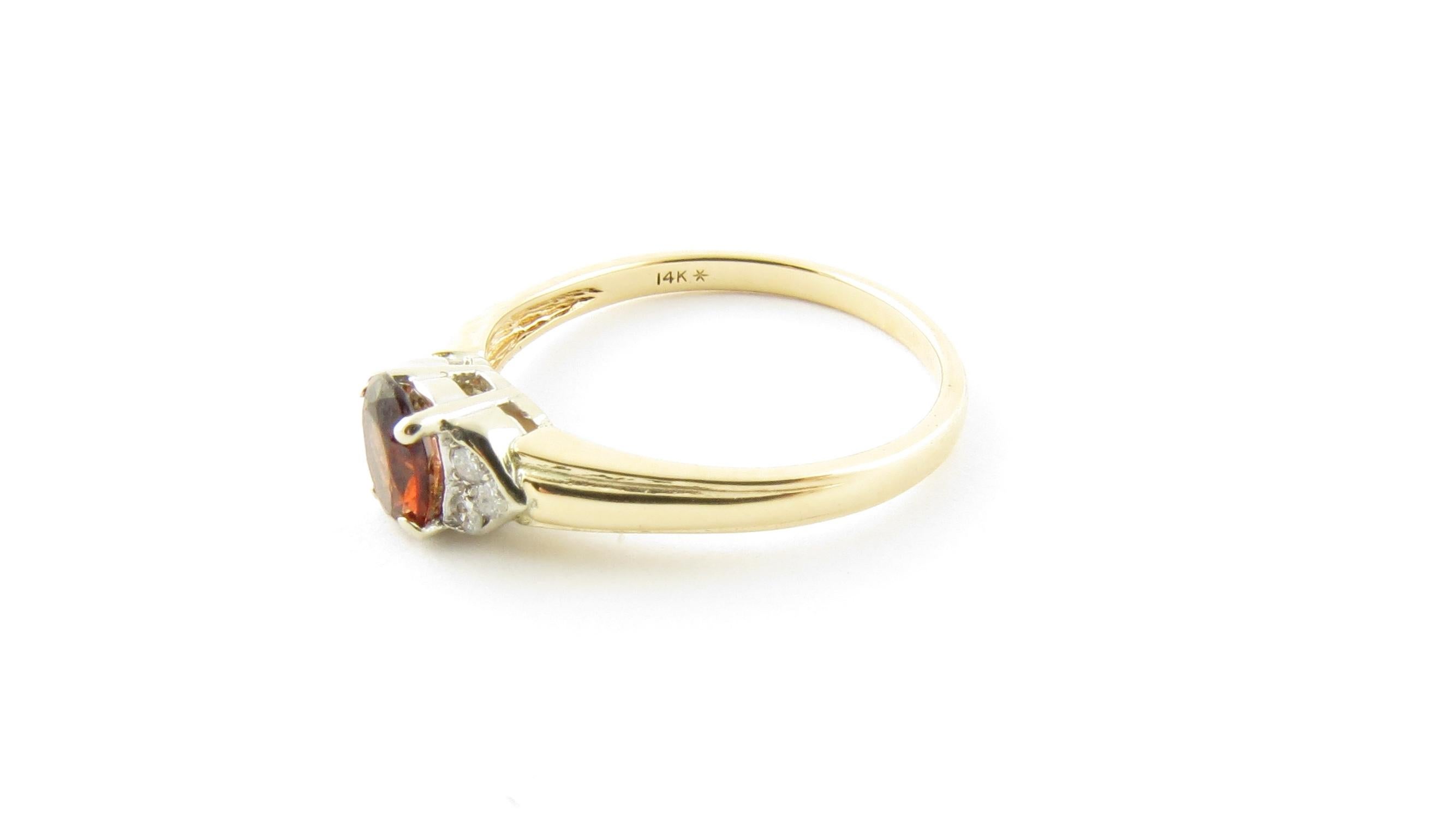 Vintage 14 Karat Yellow Gold Garnet and Diamond Ring Size 6.25

This lovely ring features one oval garnet (6 mm x 4 mm) accented with six round brilliant cut diamonds set in polished 14K yellow gold. Shank measures 1.5 mm.

Approximate total diamond