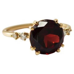 Anello in oro giallo 14 carati con granato e diamanti