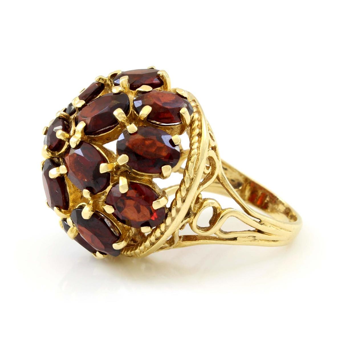 14 K Yellow Gold Garnet Dome Vintage Cocktail Ring

Metal: 14 K Yellow Gold 
Finger Size: 5.5
Gram Weight: 11.6
Diamond Carat Weight:  N/A
Diamond color: N/A
Diamond Clarity: N/A
Diamond Cut: Oval, Round 
Gemstone: Garnet
Gemstone Weight: