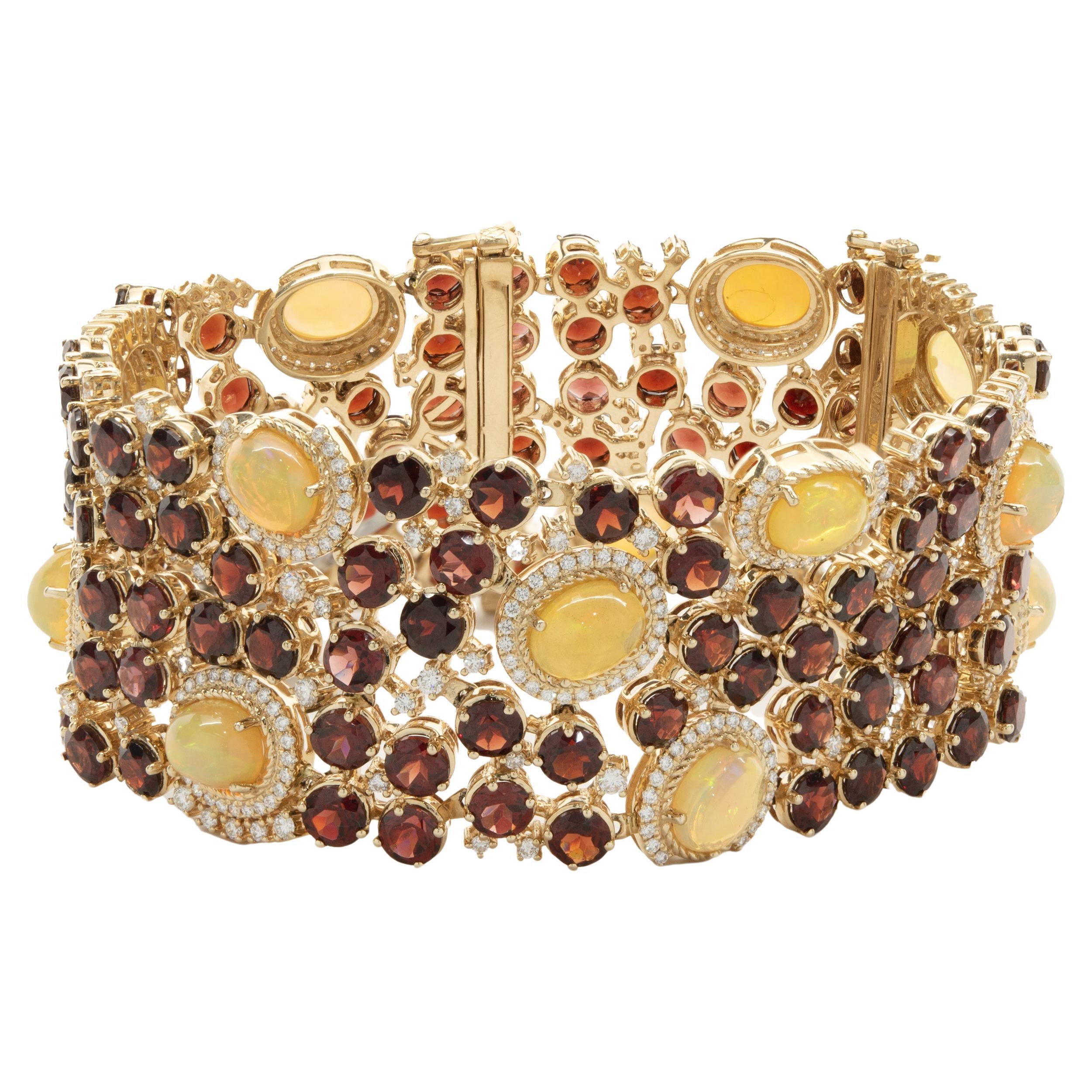 14 Karat Yellow Gold Garnet, Opal, and Diamond Ornate Wide Bracelet For Sale