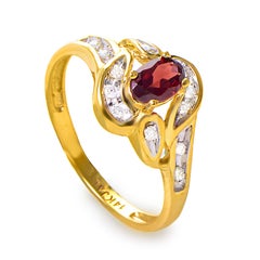 14 Karat Yellow Gold Garnet Stone and Diamond Swirl Ring