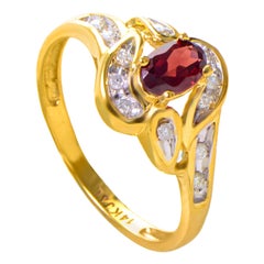 14 Karat Yellow Gold Garnet Stone and Diamond Swirl Ring