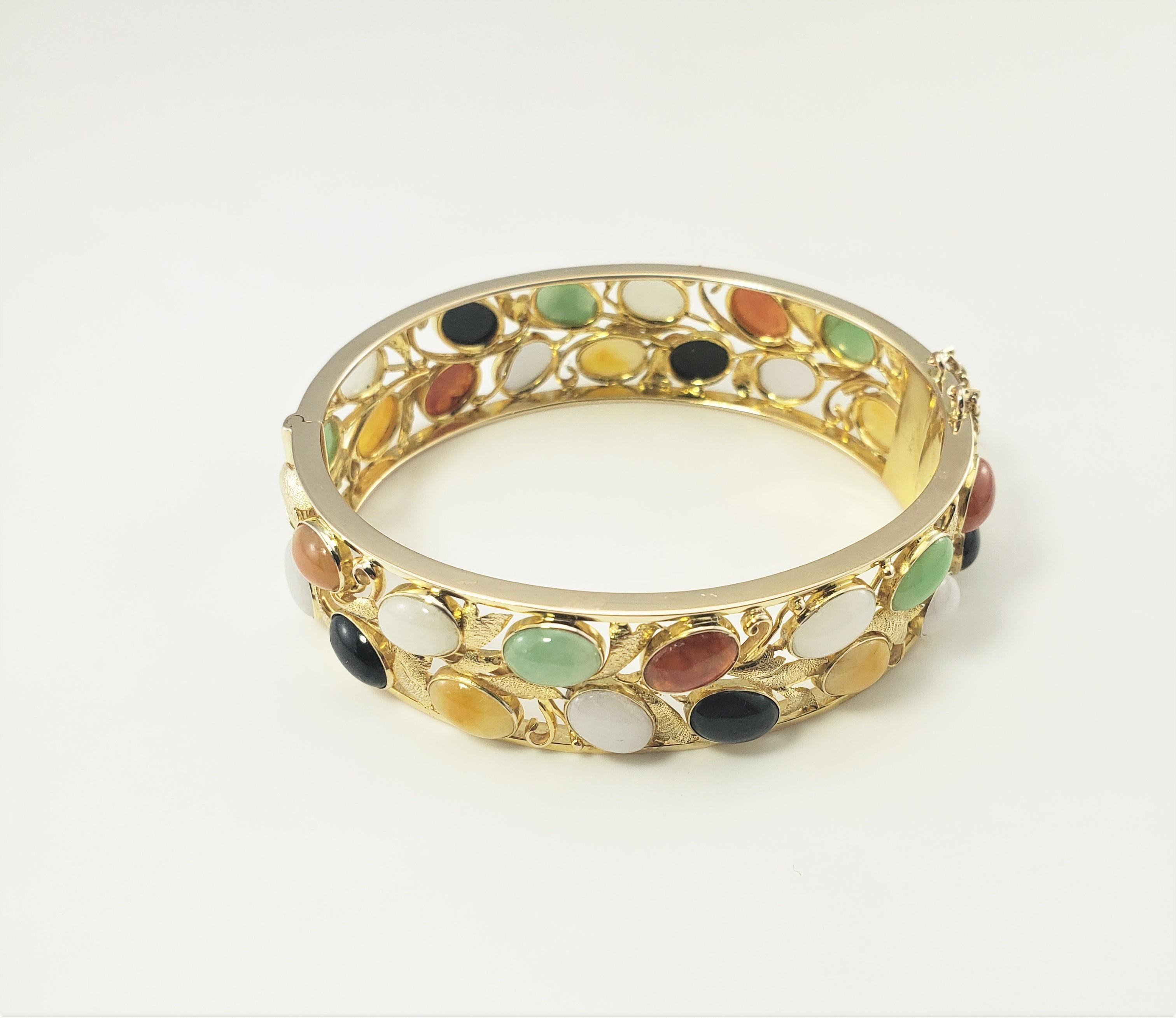 gold bracelet with gemstones