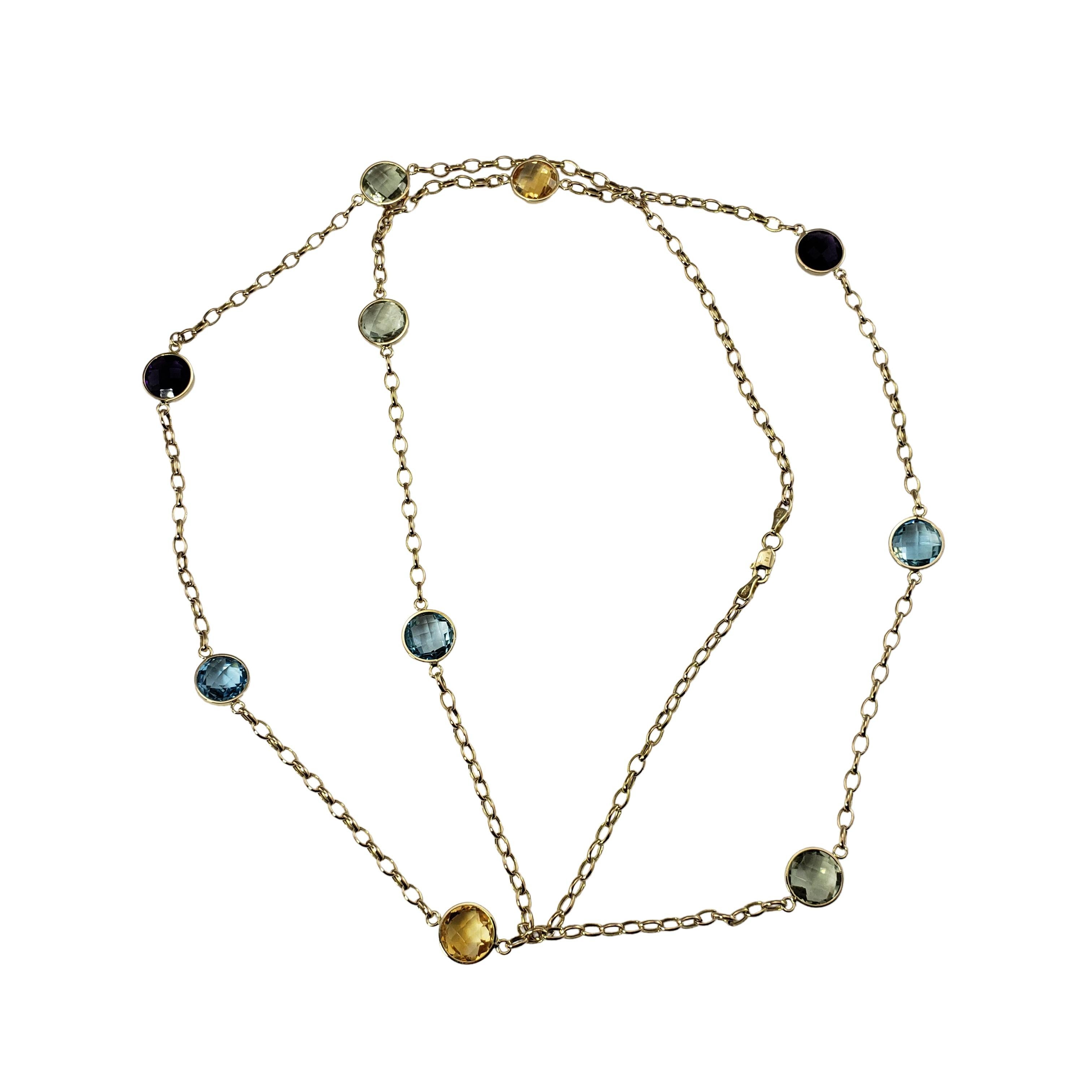 Vintage 14 Karat Yellow Gold Gemstone Necklace-

This stunning necklace features ten round 10 mm gemstones (topaz, citrine, peridot, amethyst) set on a classic 14K yellow gold necklace.

Size: 35.5 inches

Weight:  9.6 dwt. / 15.0  gr.

Stamped: 