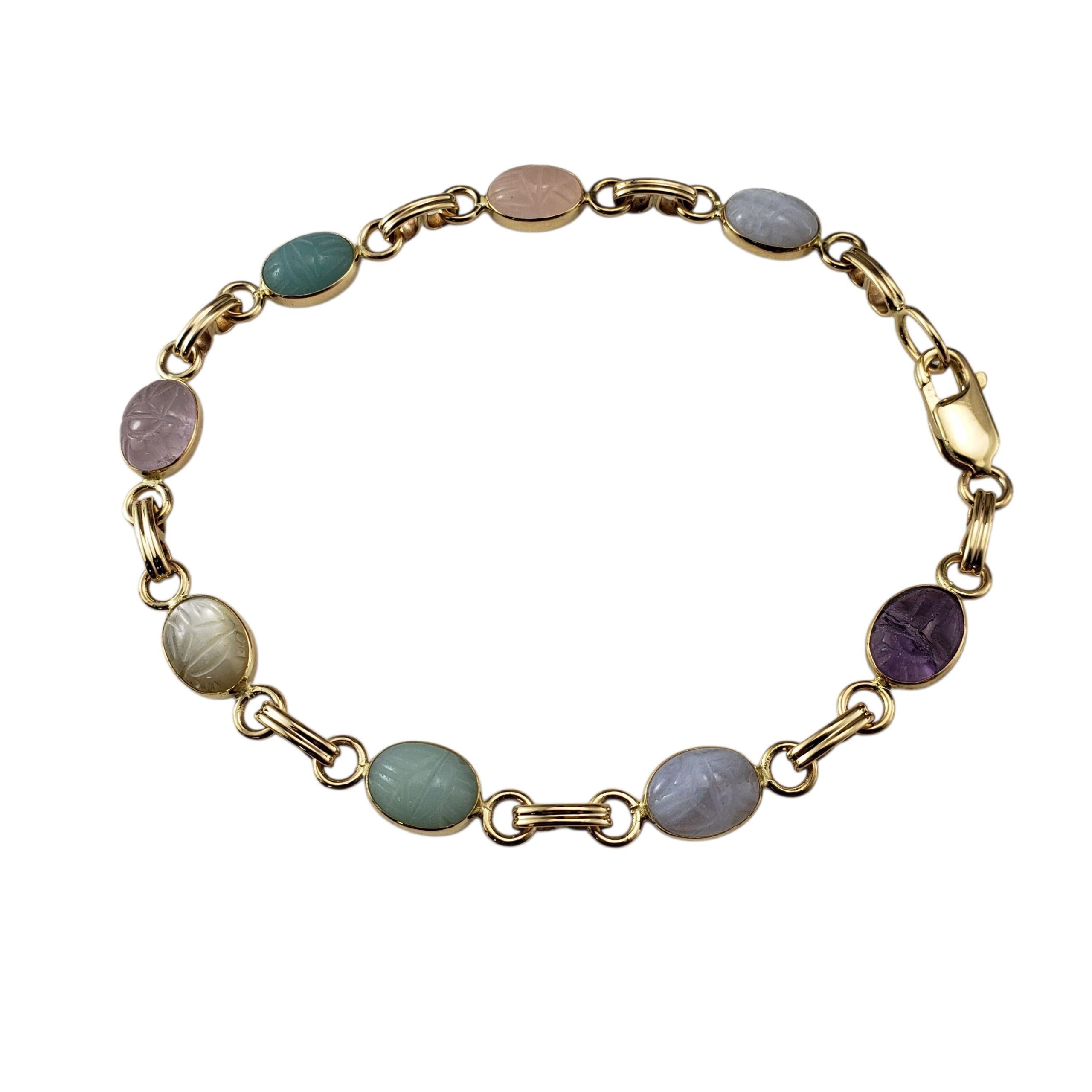Pulsera Escarabajo de Oro Amarillo de 14 Kilates y Piedras Preciosas-

Símbolo intemporal de protección y transformación, esta pulsera vintage de oro amarillo de 14 quilates presenta ocho gemas escarabajo ovaladas (8,4 mm x 6,5 mm cada una) en una