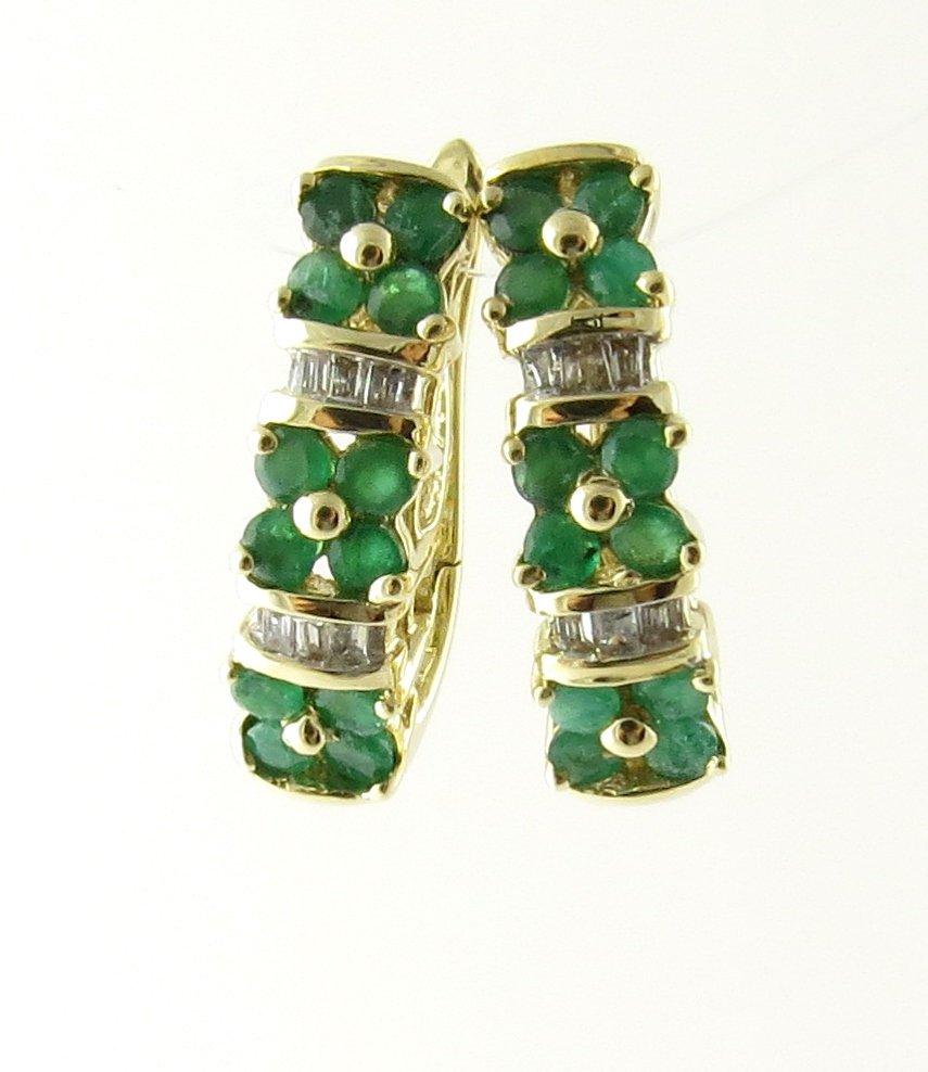 Vintage 10 Karat Yellow Gold Genuine Emerald and Diamond Earrings. These lovely hinge back earrings each feature six baguette diamonds and 12 round genuine emeralds set in classic 10K yellow gold.
Approximate total diamond weight: .24 ct. Diamond