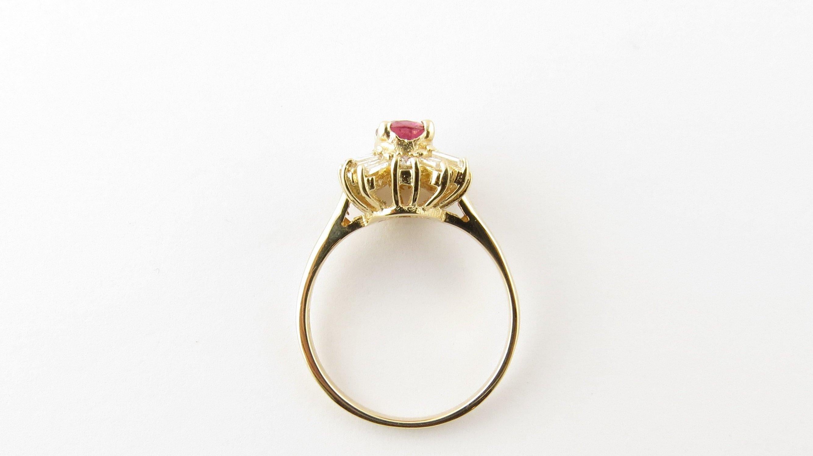 Vintage 14 Karat Yellow Gold Genuine Ruby and Diamond Ring Size 6.25 
This elegant ring features one oval genuine ruby (6 mm x 5 mm) surrounded by four round brilliant cut diamonds and 12 baguette diamonds set in classic 14K yellow gold. 
Top of