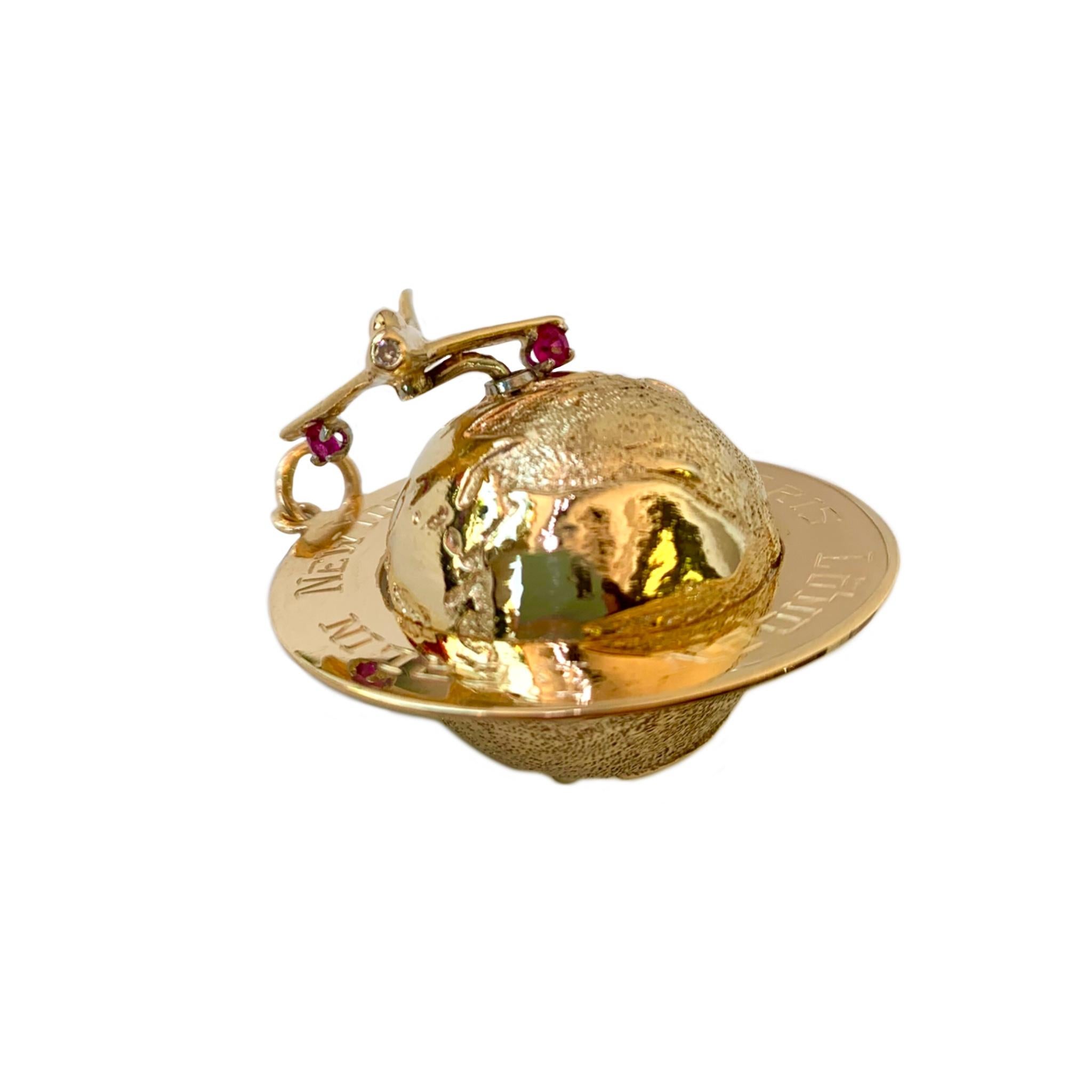Modern 14 Karat Yellow Gold Globe Charm with Movable Jet Set with Rubies and Diamonds For Sale