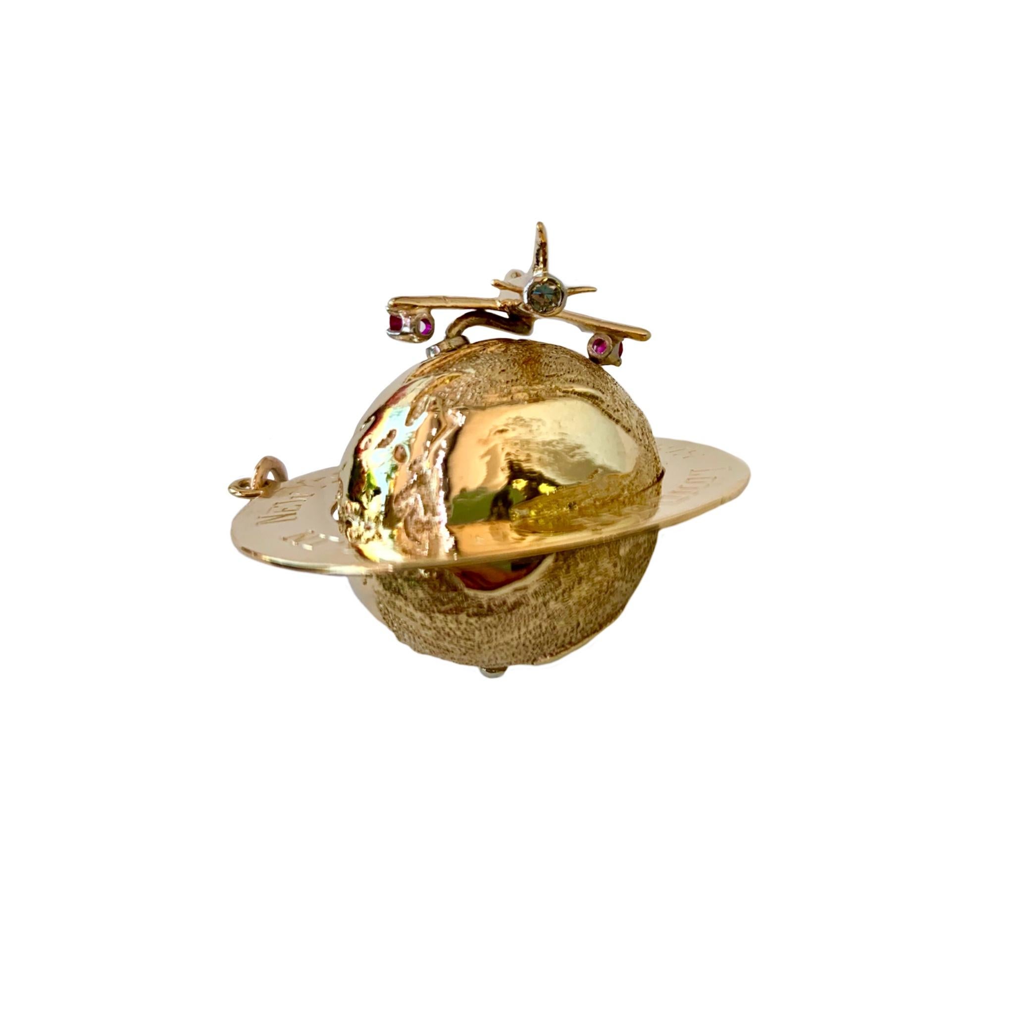 Round Cut 14 Karat Yellow Gold Globe Charm with Movable Jet Set with Rubies and Diamonds For Sale