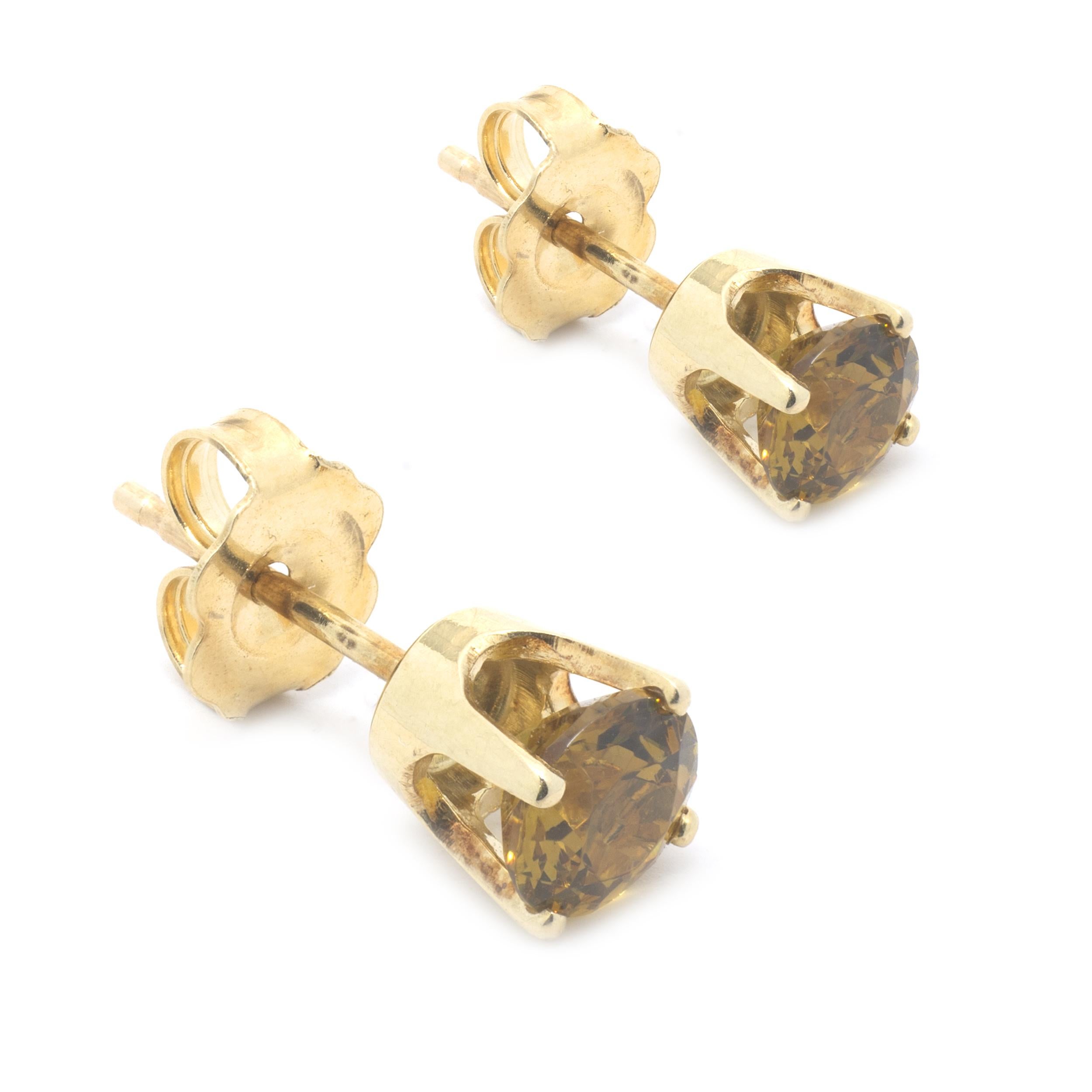 Designer: custom
Material: 14K yellow gold
Zircon: 2 round brilliant cut = 1.20cttw
Color: Golden
Clarity: AAA+
Dimensions: earrings measure 5mm in diameter
Weight: 1.22 grams
