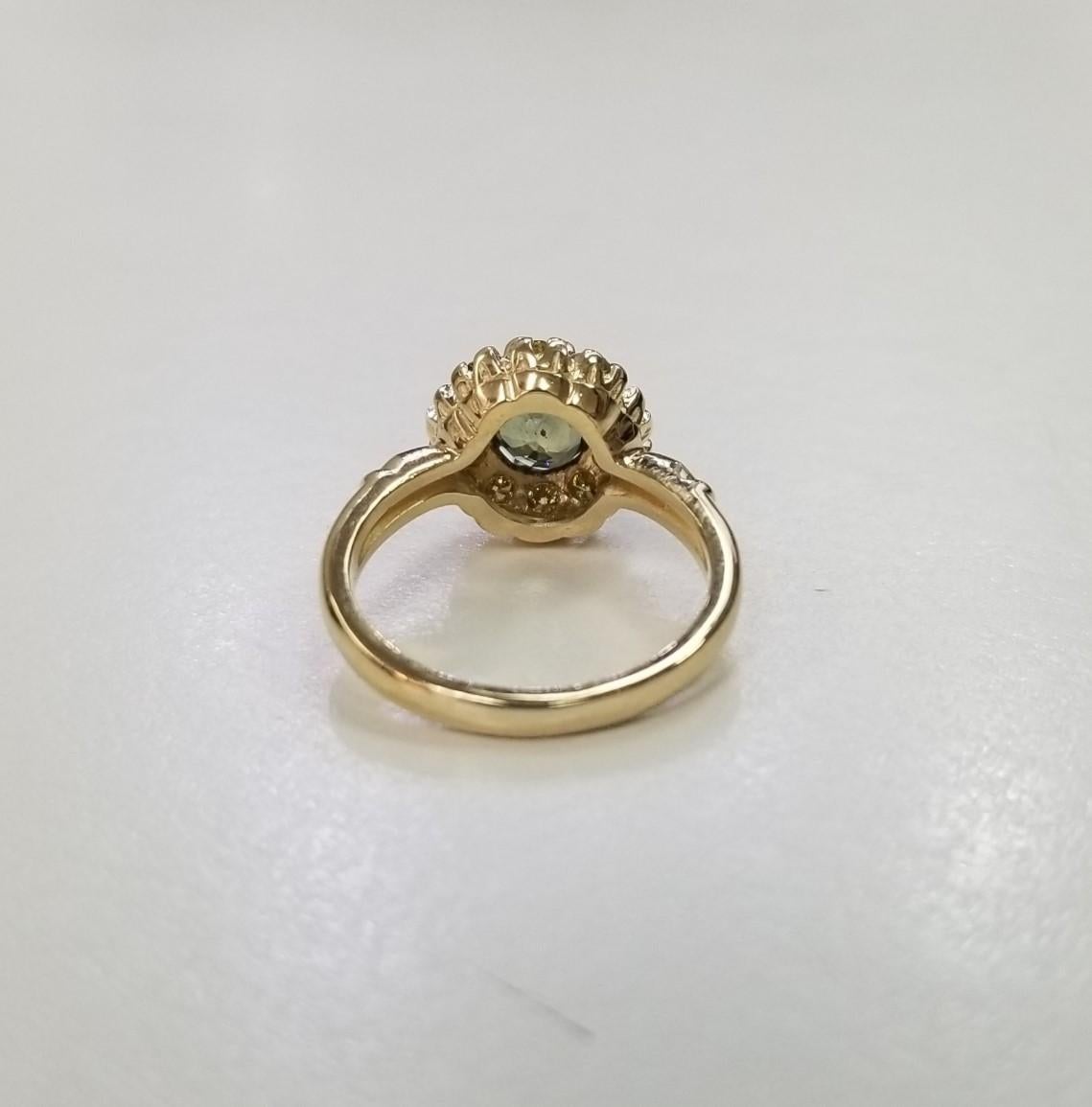 Contemporary 14 Karat Yellow Gold Green Sapphire yellow Diamond Halo Ring For Sale