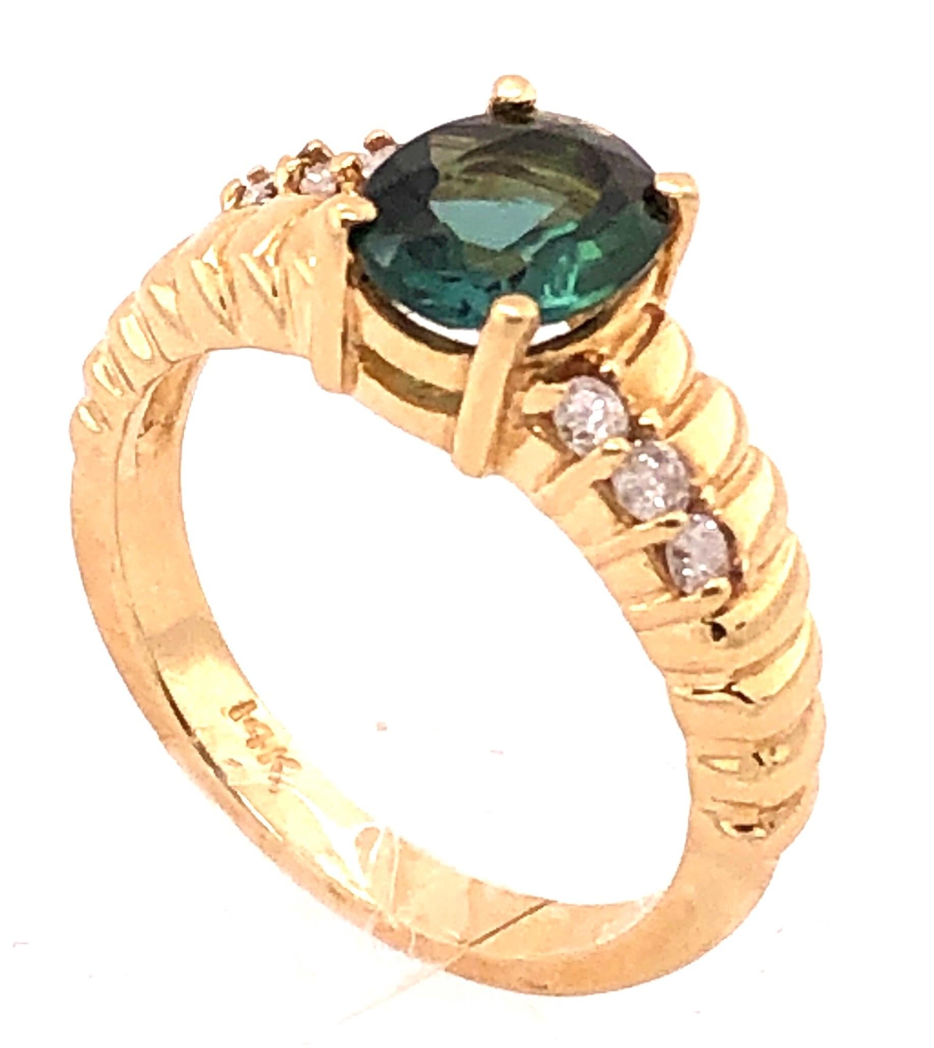14 Karat Yellow Gold Green Topaz Solitaire Ring with Diamond Accents 0.30 TDW.
Size 5.5 
4 grams total weight.
