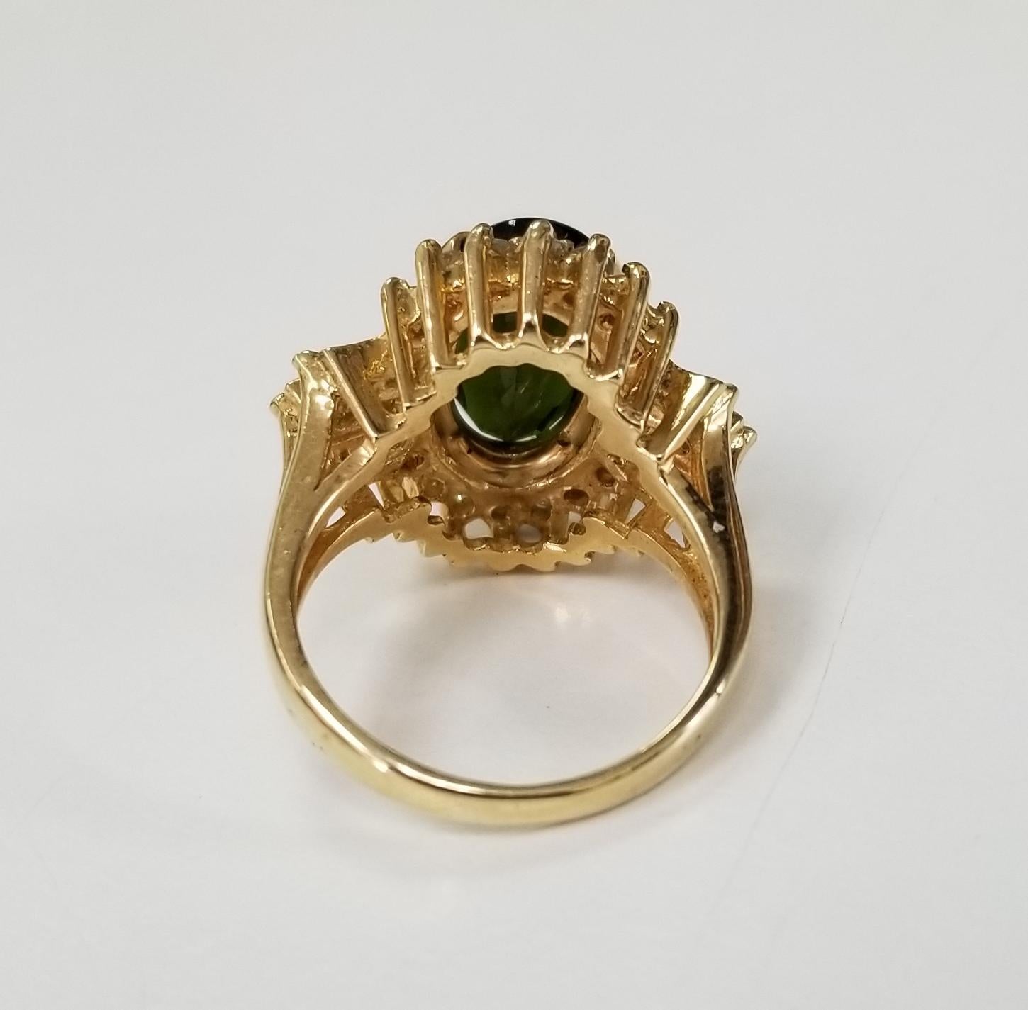 Oval Cut 14 Karat Yellow Gold Green Tourmaline and Diamond Ring For Sale