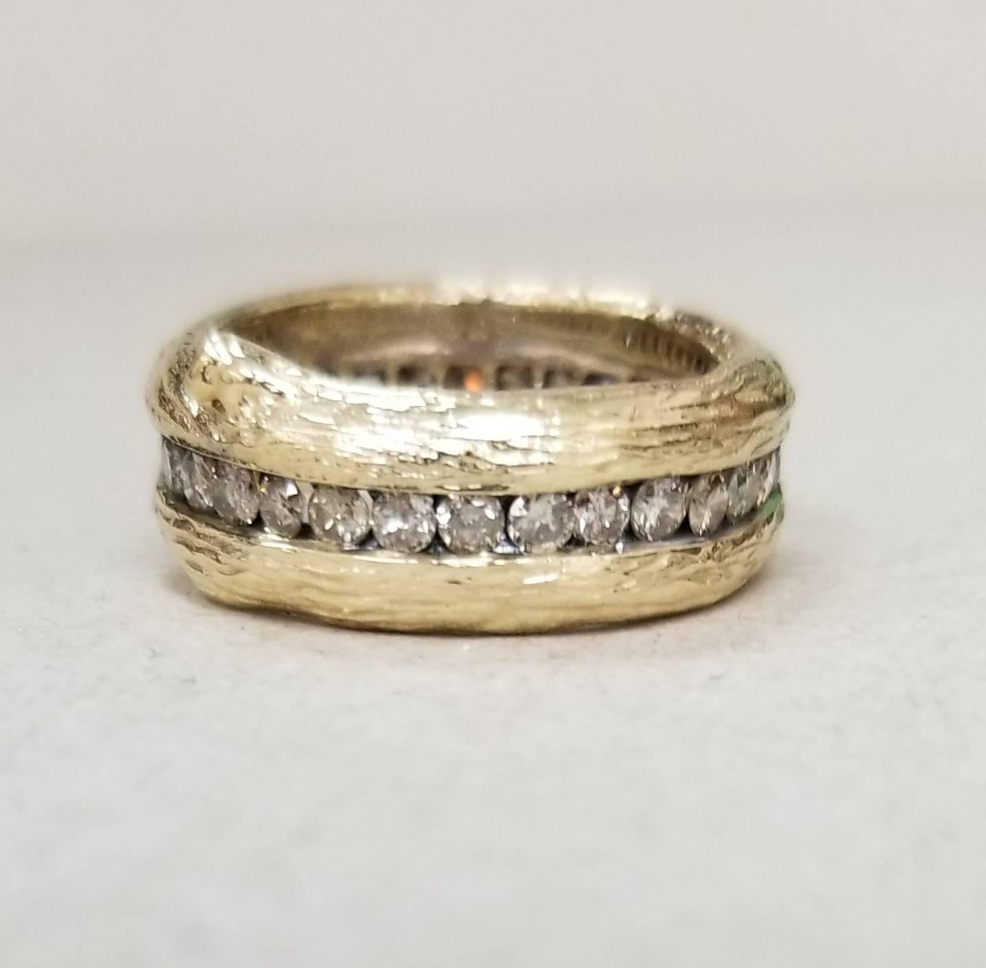 14k yellow gold Gresha signature bark and diamond eternity ring containing 30 round full cut diamonds weighing 1.20cts. with an antiquing on behind the diamonds. ring size is 6 (but could be made to fit with adjusted price).
*this design is ours and