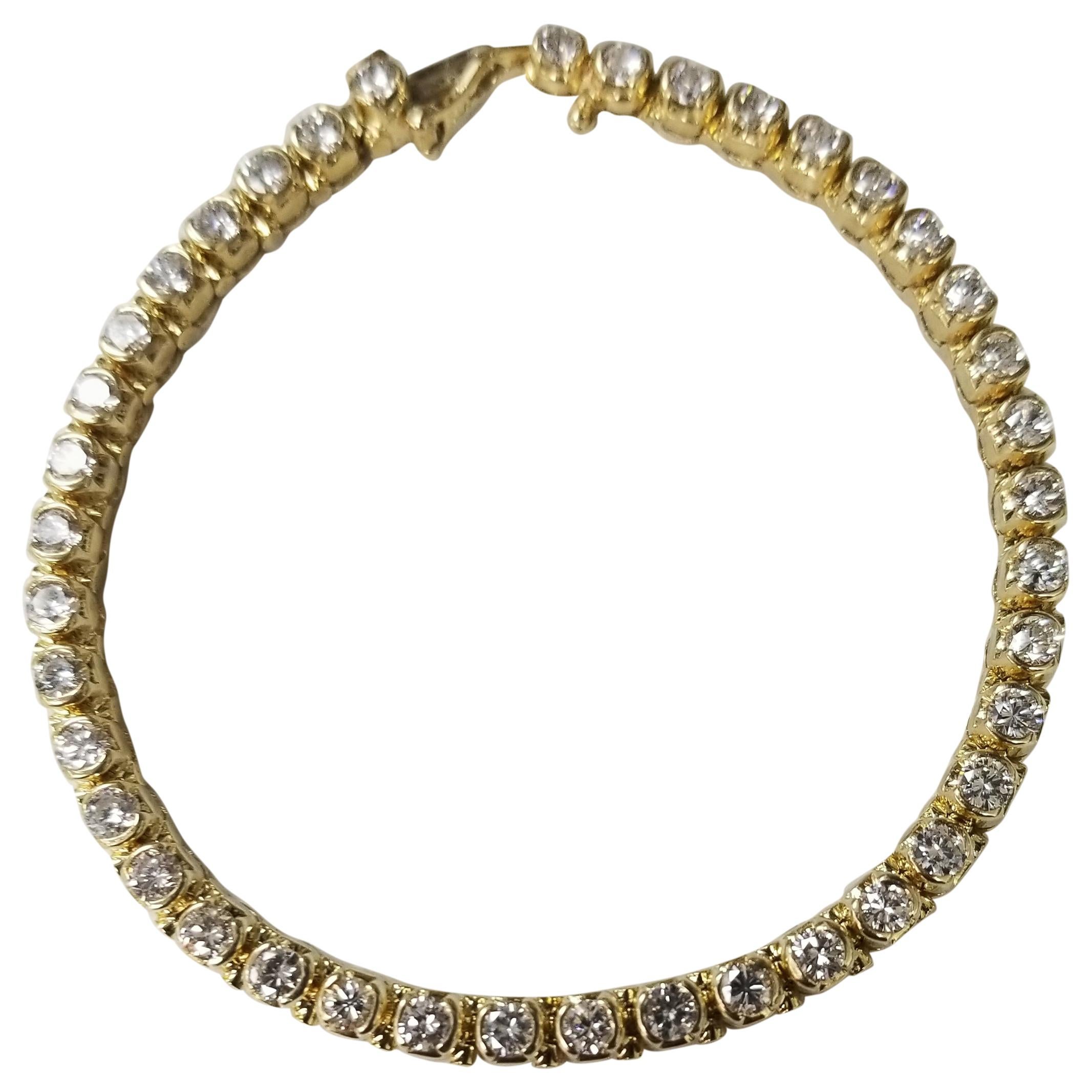 14 Karat Yellow Gold Half Bezel Set Diamond Tennis Bracelet Weighing 5.00 Carat