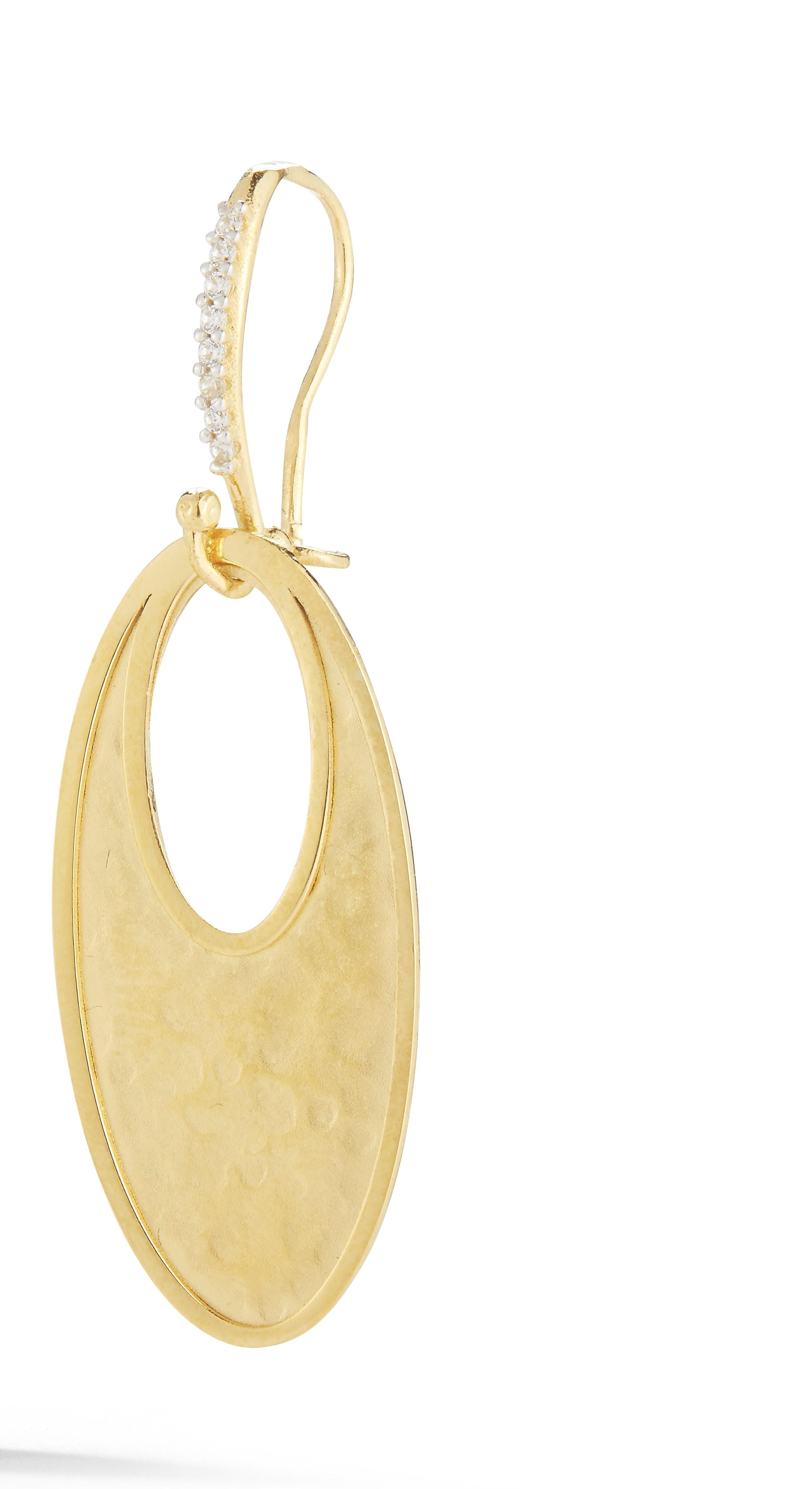 14 Karat Yellow Gold Hand-Crafted Matte and Polish-Finished Open Oval Dangling Earrings, Accented with 0.10 Carats of Pave Set Diamonds, on a Leverback Closure.

