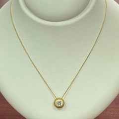 14 Karat Yellow Gold Hammered Pendant with a '1.01 Ct' Radiant Cut Diamond