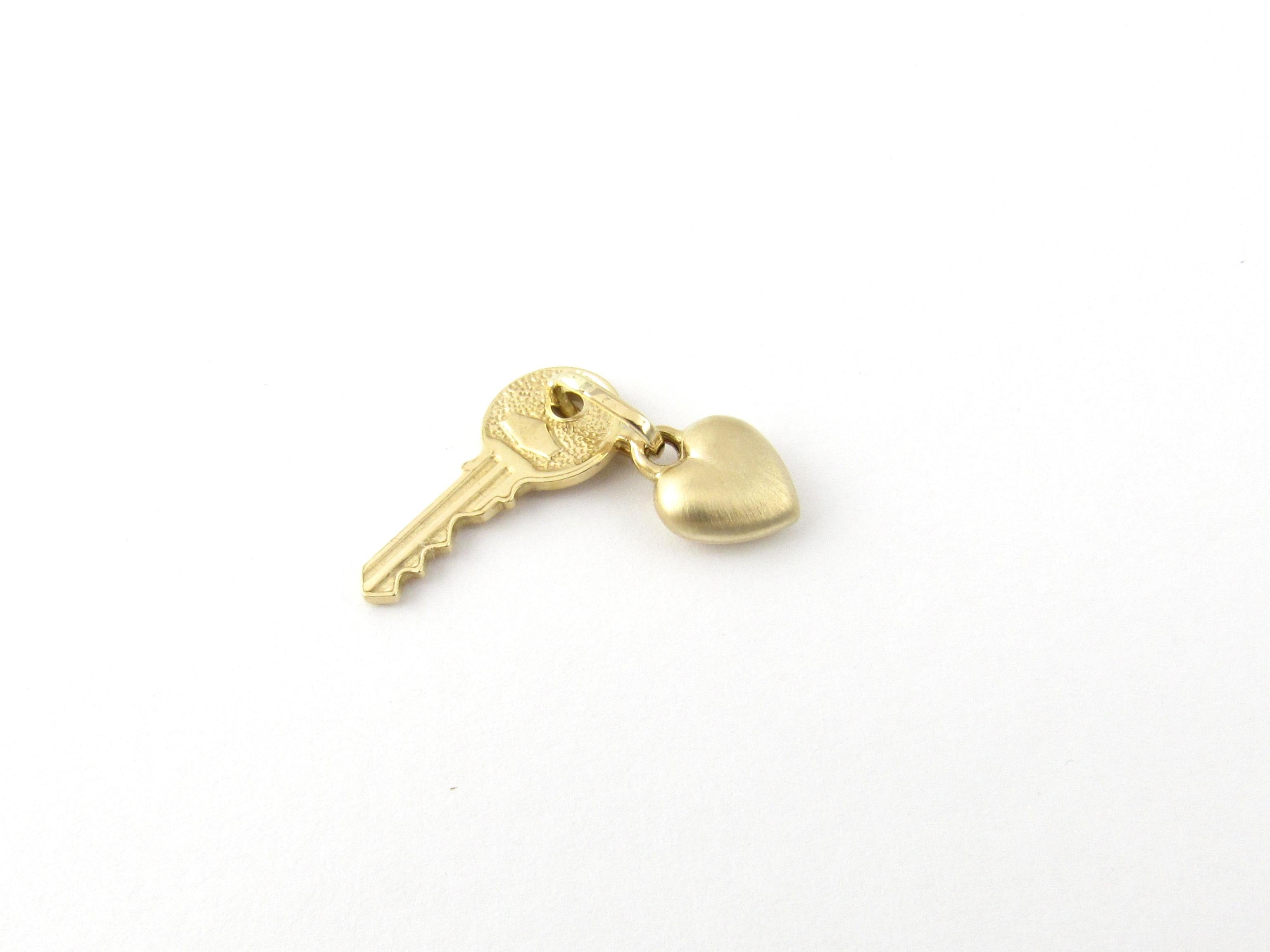 Vintage 14 Karat Yellow Gold Heart and Key Charm

Give her the key to your heart!

This lovely 3D charm features a miniature heart and key beautifully detailed in 14K gold.

Size: key - 19 mm x 9 mm 
heart - 10 mm x 8 mm

Weight: 0.9 dwt. / 1.5