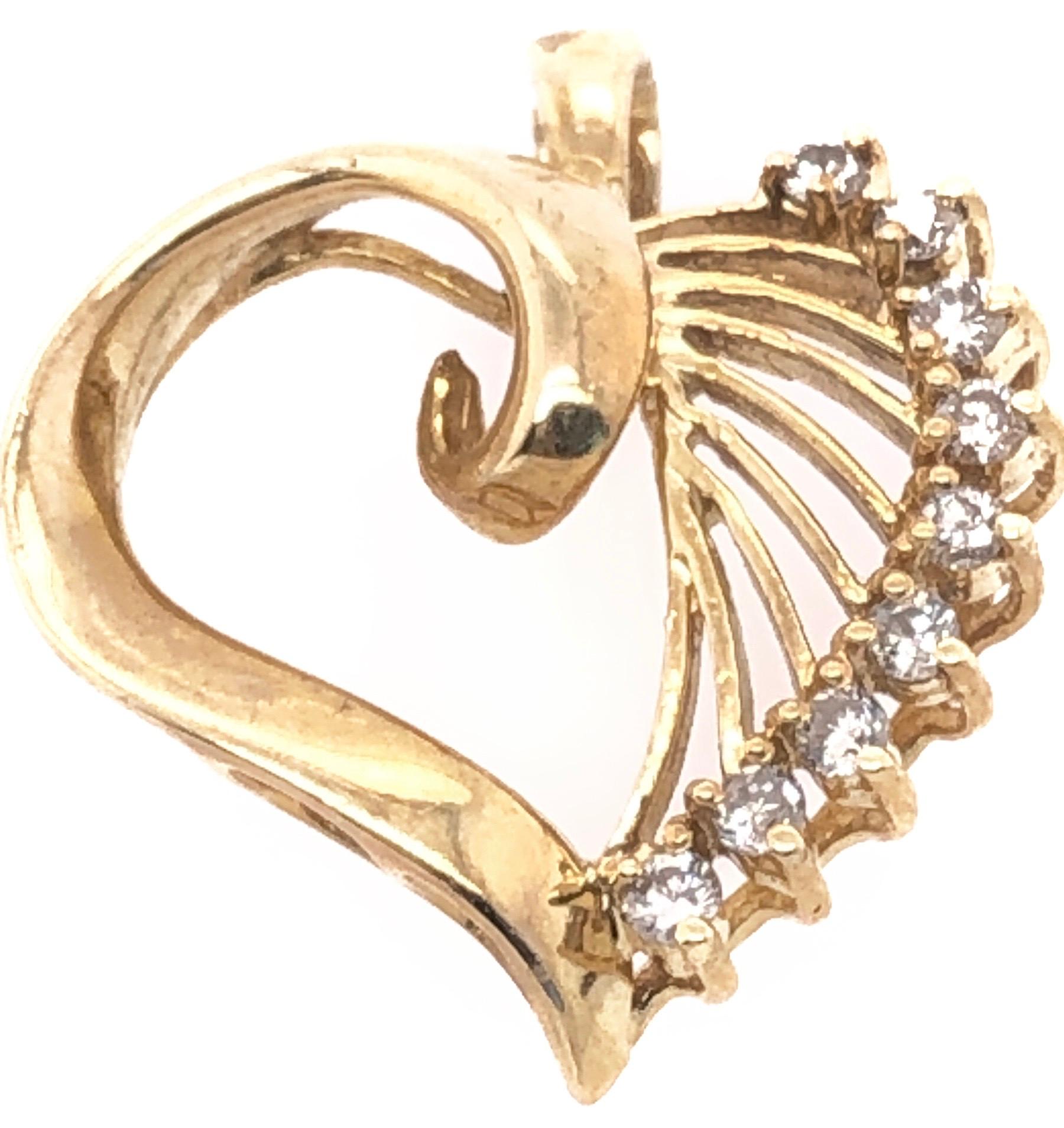 14 Karat Yellow Gold Heart Pendant with Round Diamonds.
0.27 total diamond weight.
3.12 grams total weight.