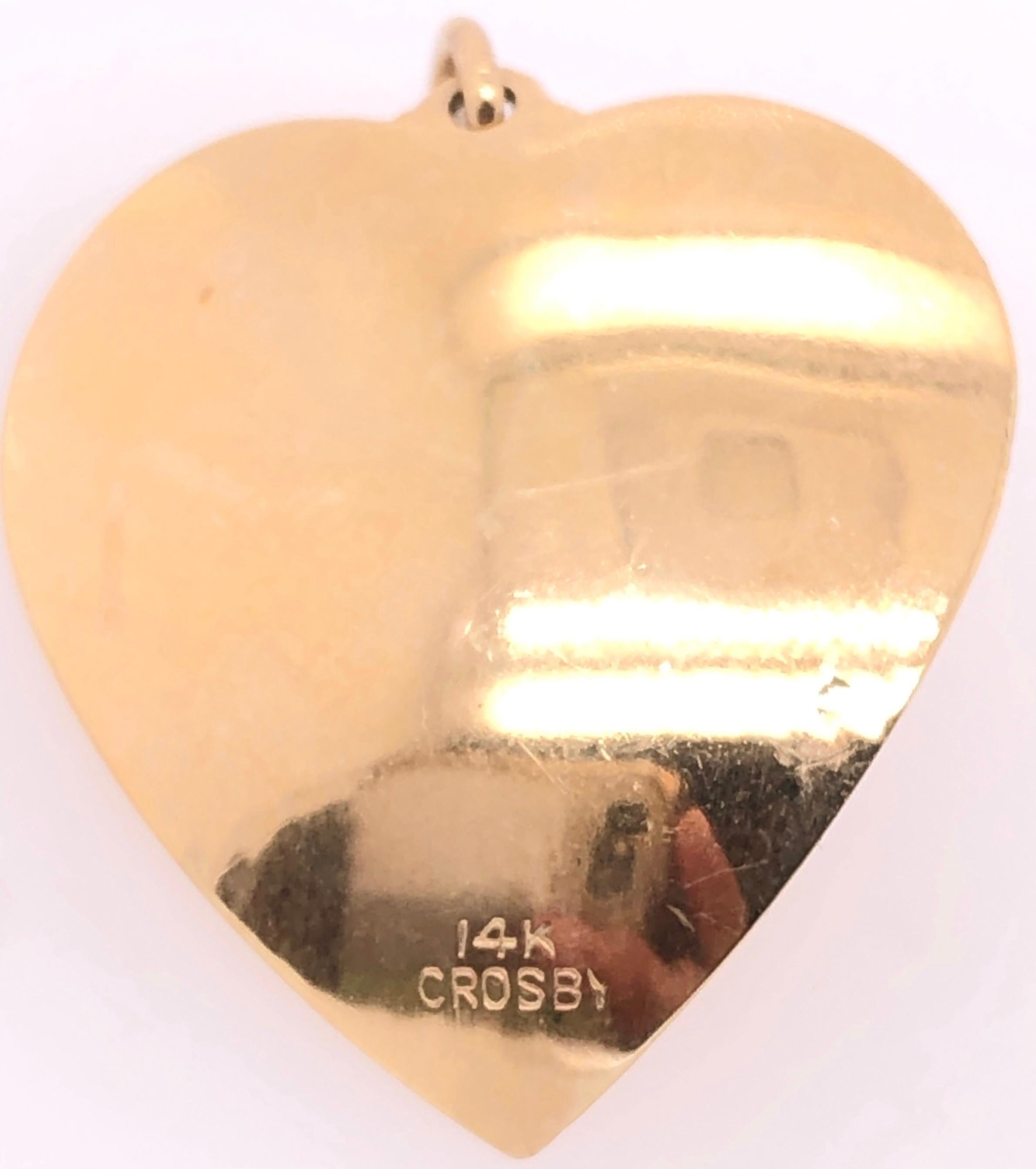 pendentif en or jaune 14 carats en forme de cœur avec perle.
3.poids total de 55 grammes.