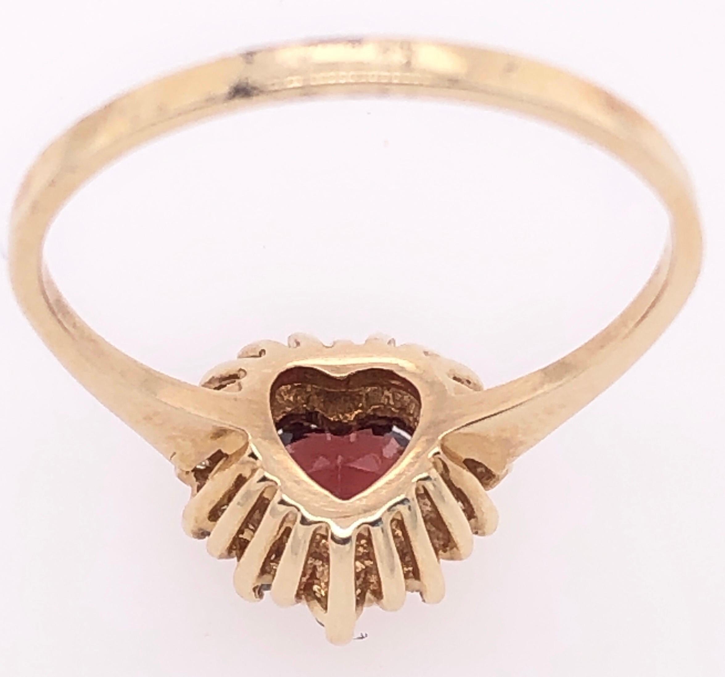 Women's or Men's 14 Karat Yellow Gold Heart Shape Garnet Solitaire with Diamond Accents Ring For Sale