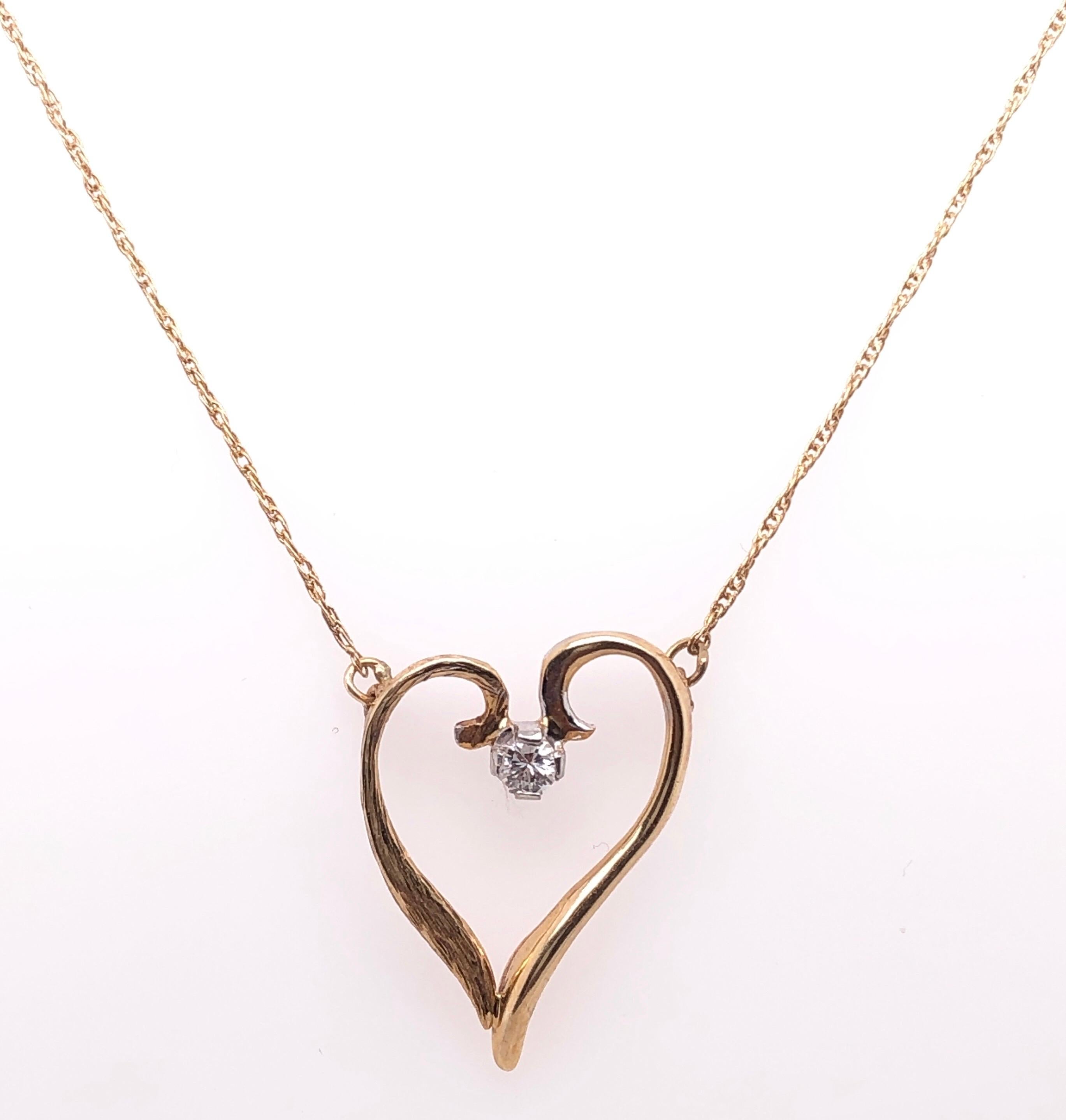 14 Karat Yellow Gold 16 inch Necklace with Heart Pendant and Round Diamond.
0.10 Total Diamond Weight.
2.49 grams total weight.