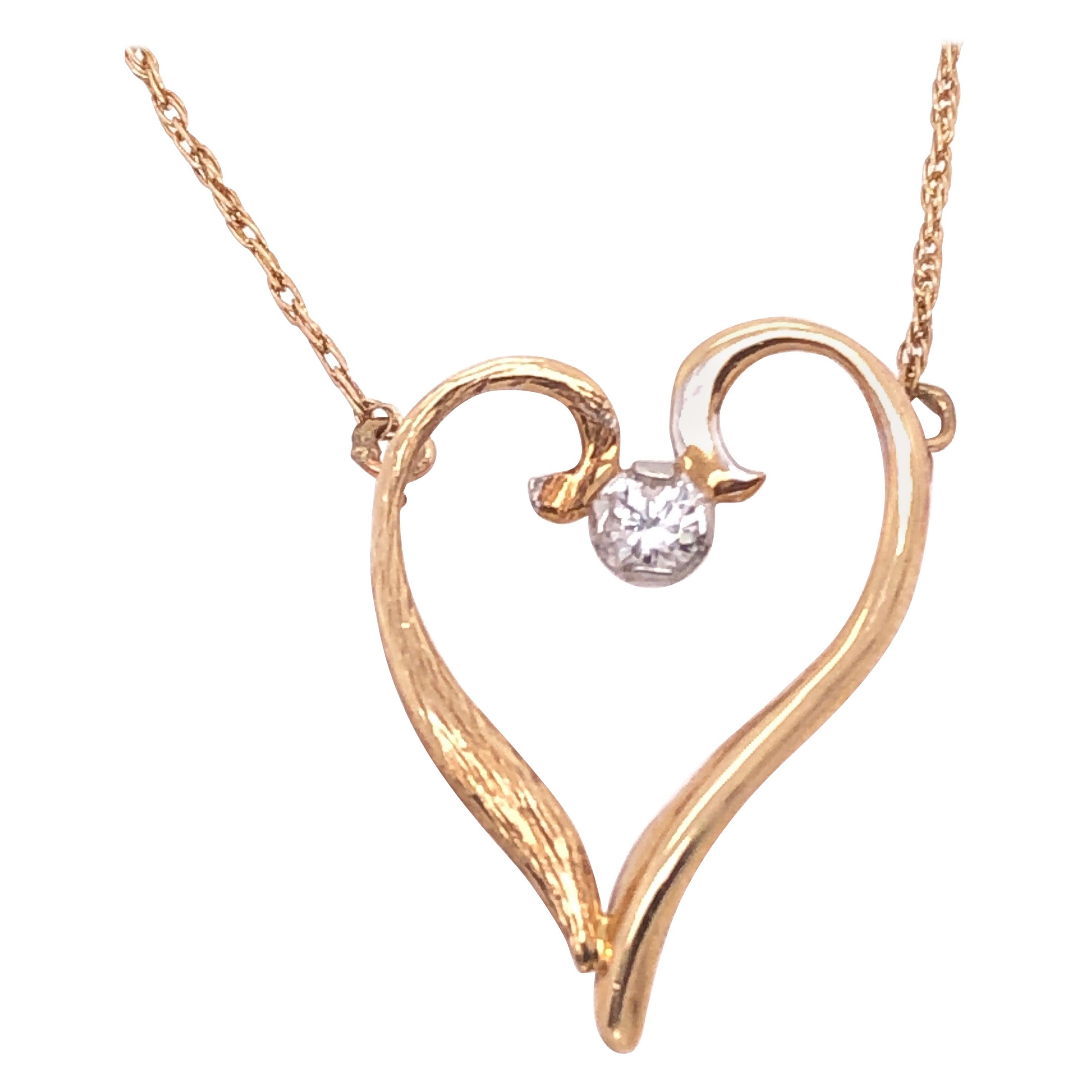 Collier pendentif cœur soudé en or jaune 14 carats avec diamants au centre en vente