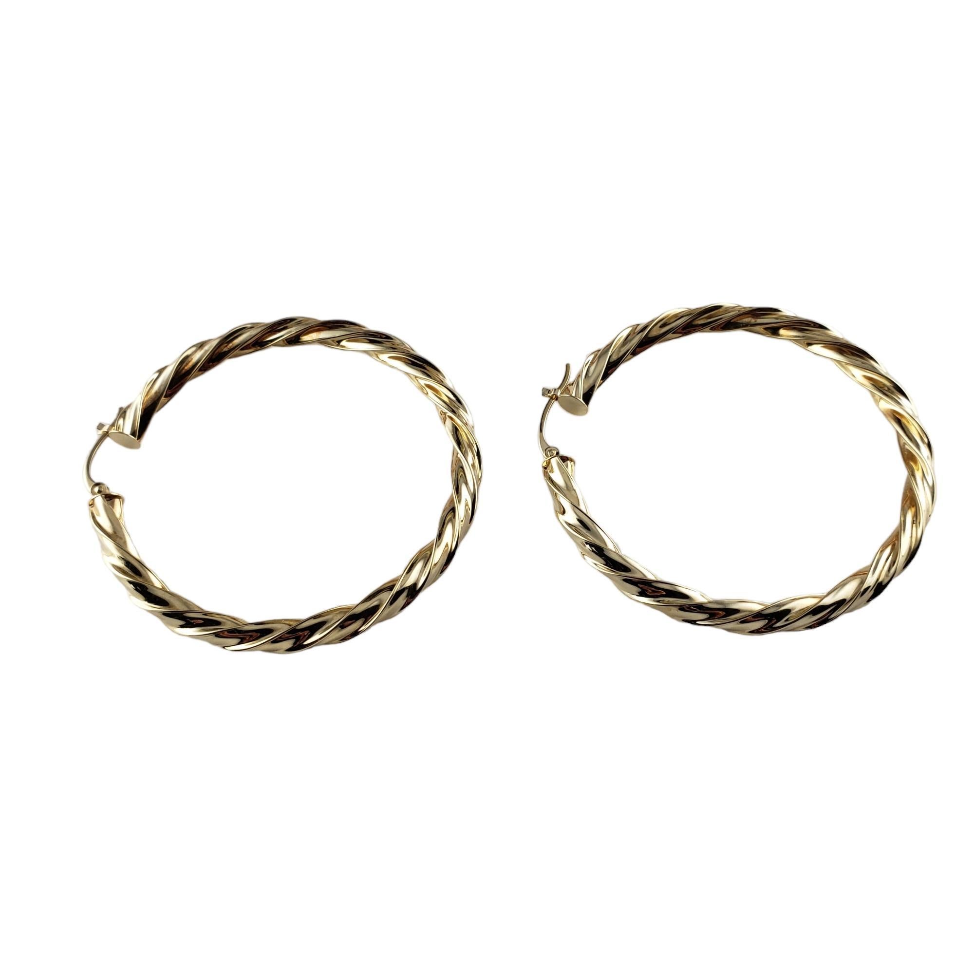 Vintage 14 Karat Yellow Gold Hoop Earrings-

These elegant hoop earrings are crafted in beautifully detailed 14K yellow gold.

Size:  45.6 mm 

Stamped: 14K

Weight: 3.8 gr./ 2.4 dwt.

Very good condition, professionally polished.

Will come