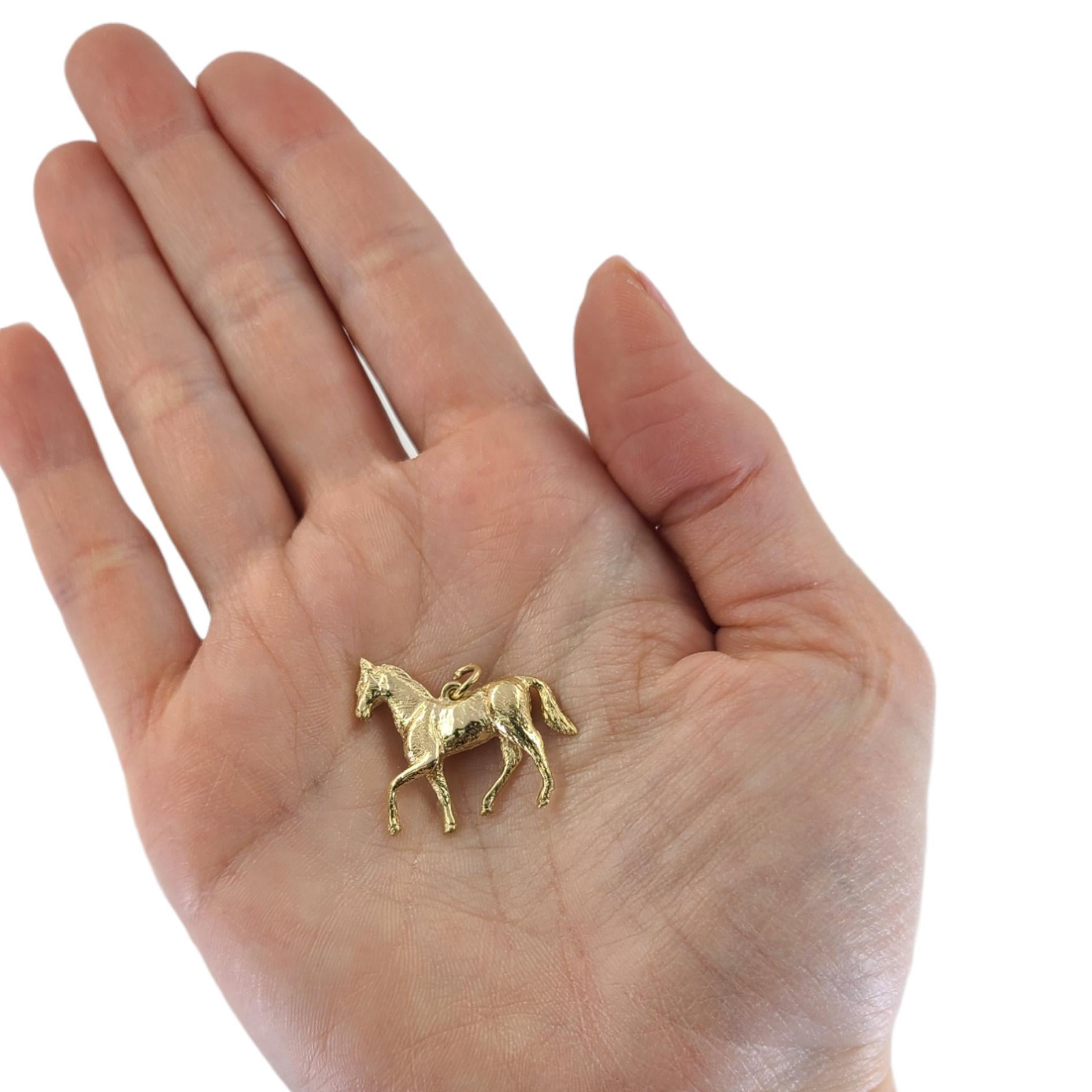 14 Karat Yellow Gold Walking Horse Pendant/Charm With Textured Accents. 1 Inch Width By 0.88 Inch Length. Finished Weight Is 6.5 Grams.