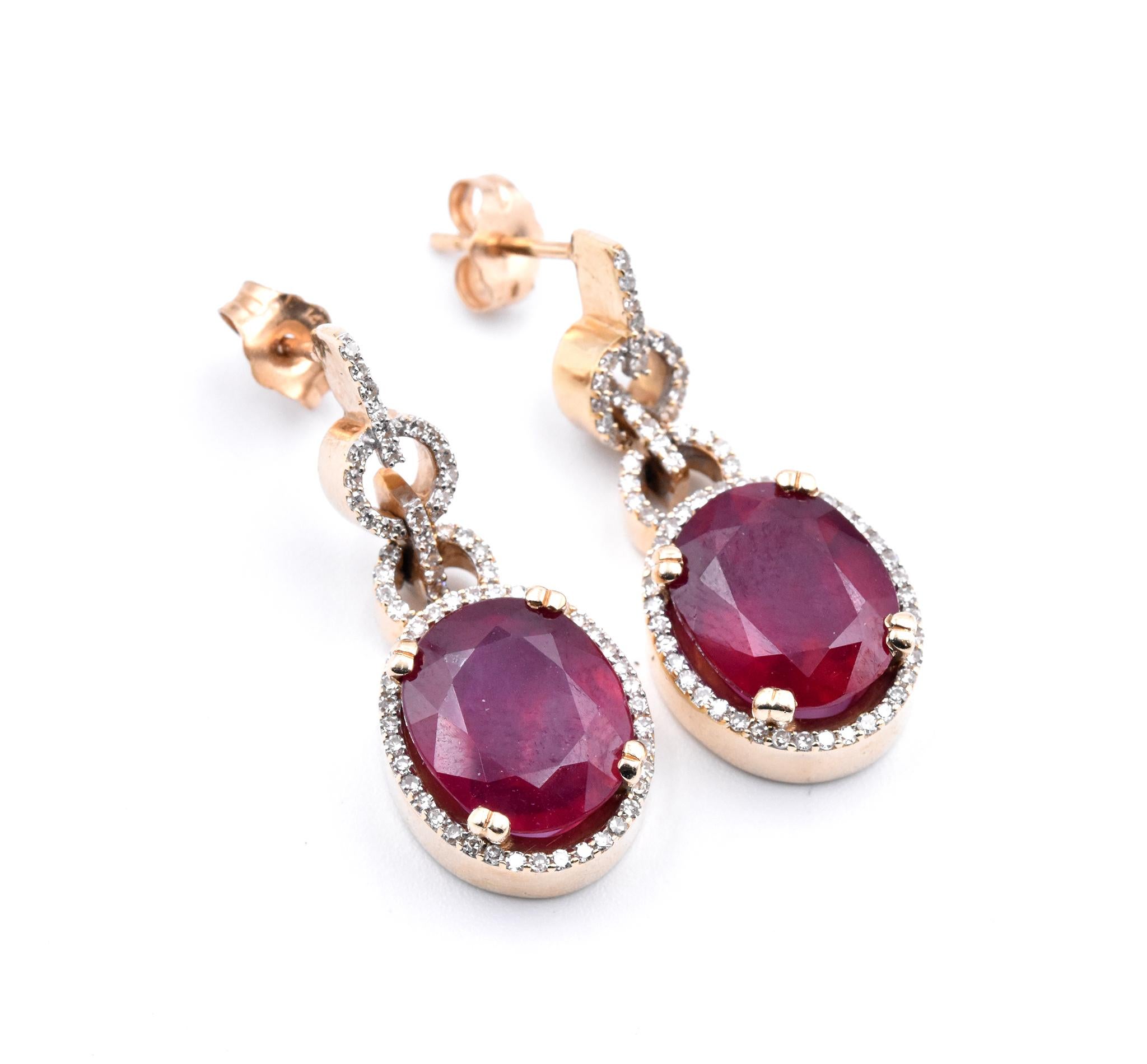 Designer: custom design
Material: 14K yellow gold
Gemstone: 2 Ruby’s = 10.25cttw 
Diamonds: 138 round brilliant cut = .90cttw
Color: H
Clarity: SI
Dimensions: earrings measure 11.6mm X 28.55mm
Fastenings: friction backs
Weight: 9.37 grams
