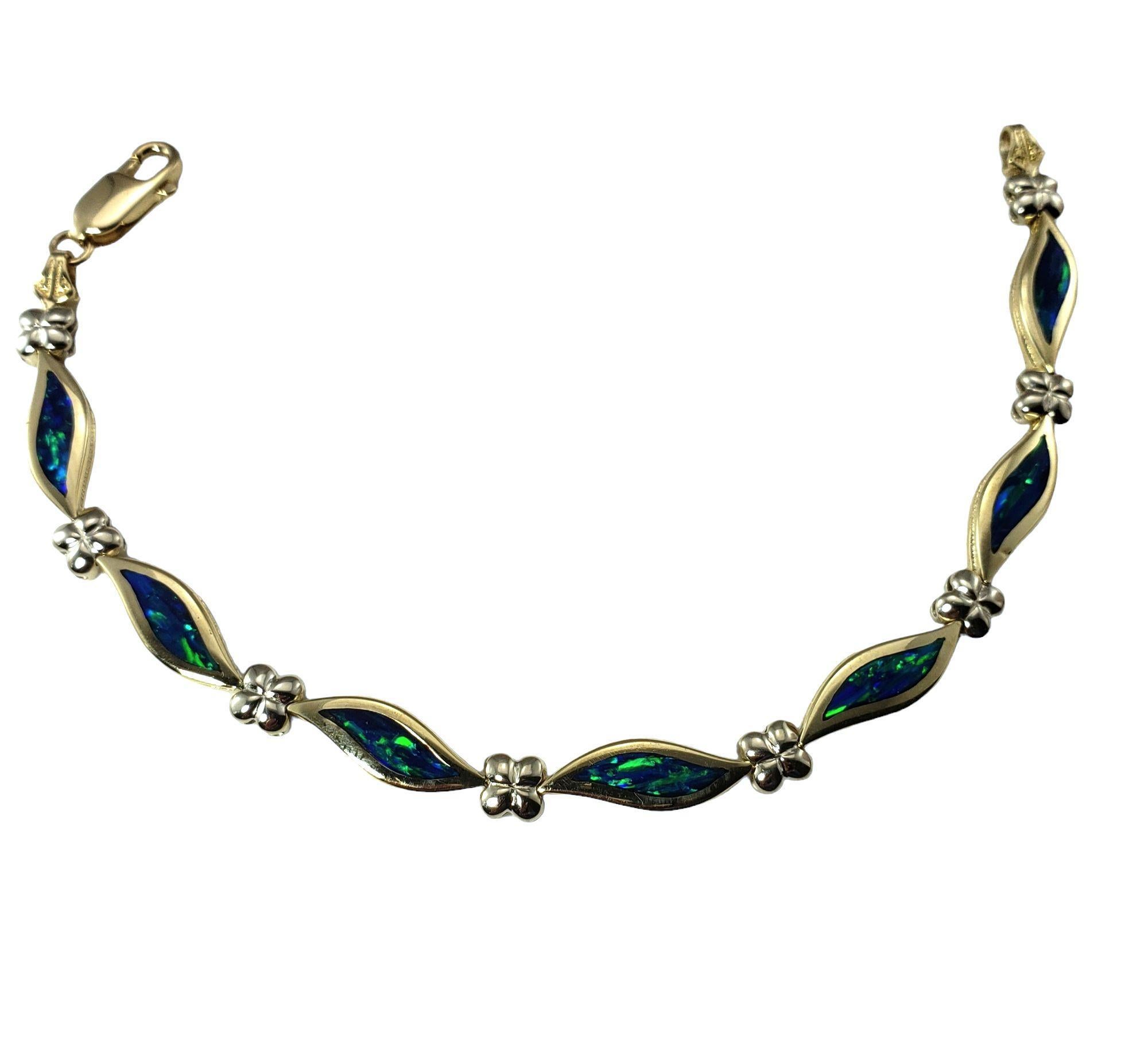 14 Karat Yellow Gold Inlaid Opal Bracelet-

This stunning bracelet features lovely inlaid opal set in beautifully detailed 14K yellow gold. Width: 6 mm.

Size: 6.75 inches 

Weight: 9.0 dwt. / 14 gr.

Stamped: 14K

Very good condition,