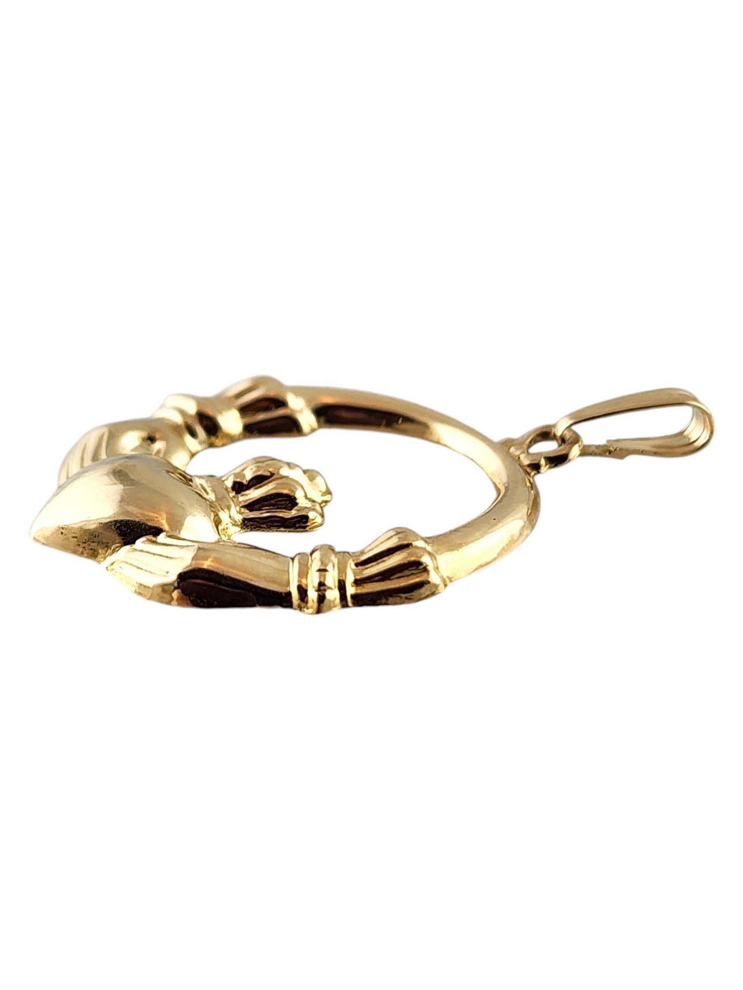 14 Karat Yellow Gold Irish Claddagh Pendant

This beautiful claddagh pendant was meticulously crafted from 14K yellow gold and would look great paired with a matching chain!

Size: 28.4mm X 24.42mm X 3.07mm
Length w/ bail: 35.15mm

Weight: 0.90 dwt/